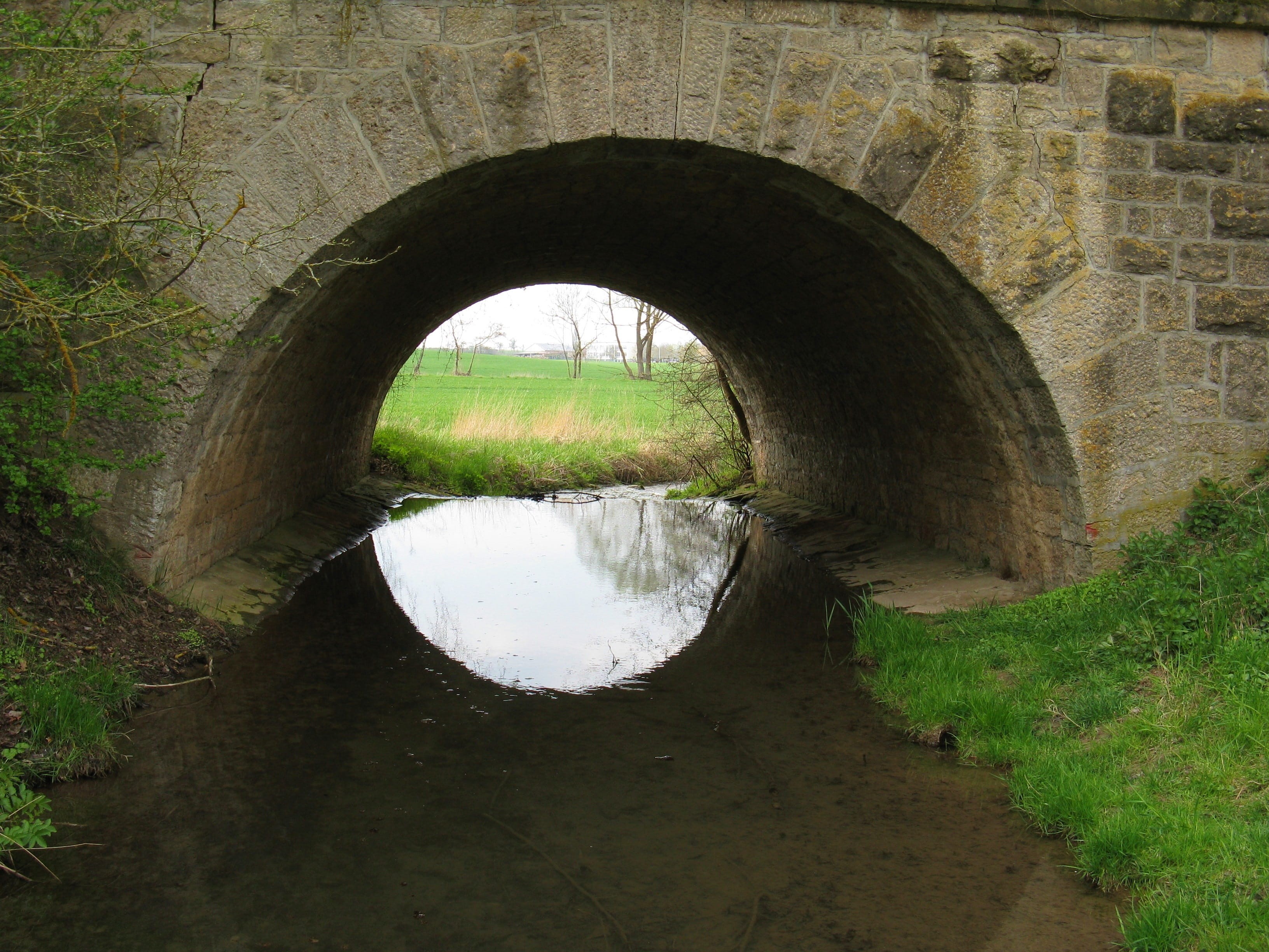 arch bridge, reflection, day, stone wall, swiss francs, hole, round, no people, watercourse, grass, old, bridge, bridge - man made structure, tunnel, 2K, HD Wallpaper