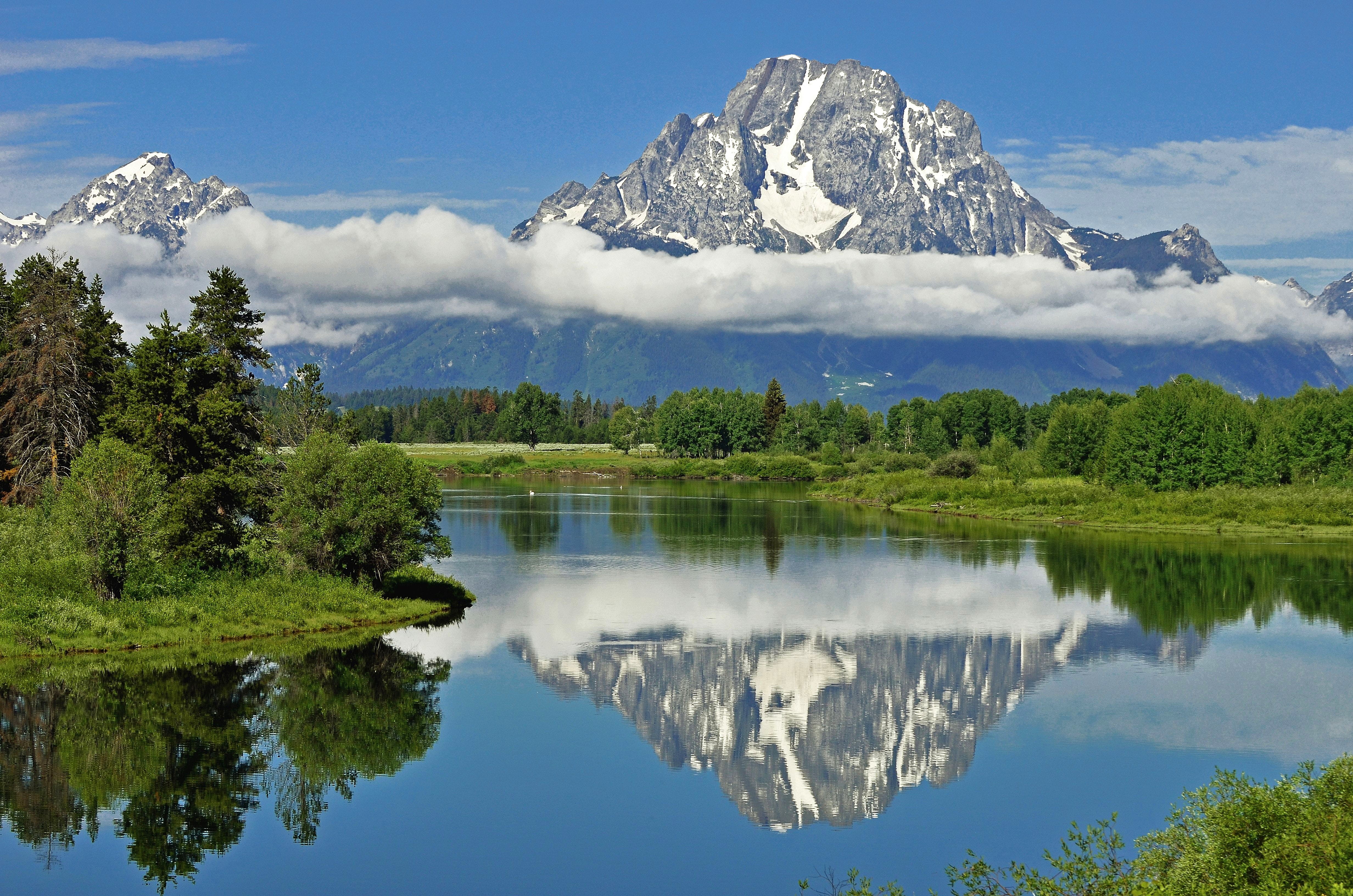 reflection, grand tetons. mount moran, sky, 4K, pine tree, mountain, day, abies, water, tranquility, pond, weather, green color, near, snowcapped mountain, HD Wallpaper