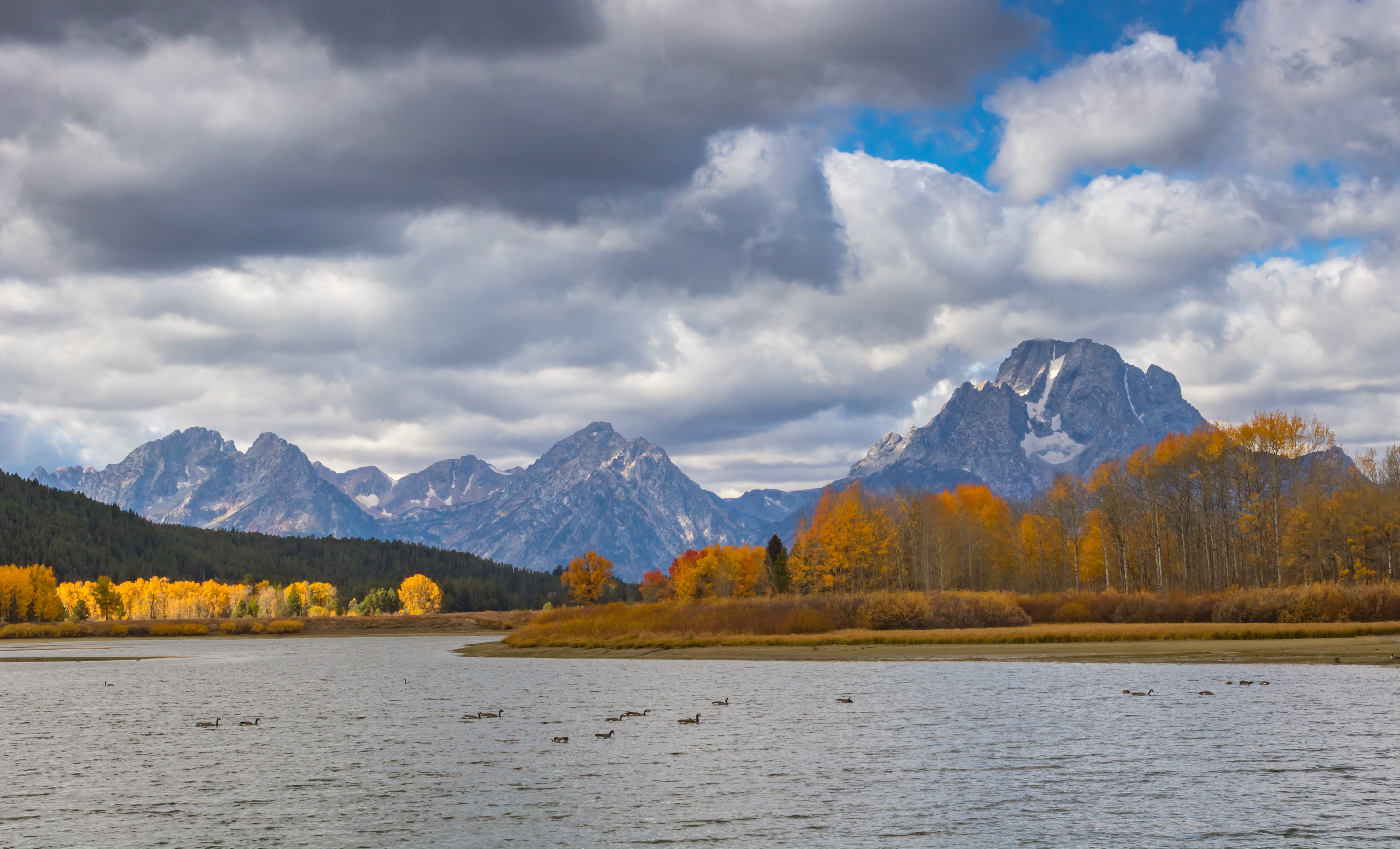 snow, environment, mountain, grand teton, mountain peak, tranquil scene, waterfront, near, outdoors, surround, nature, weather, water, day, snowcapped mountain, HD Wallpaper