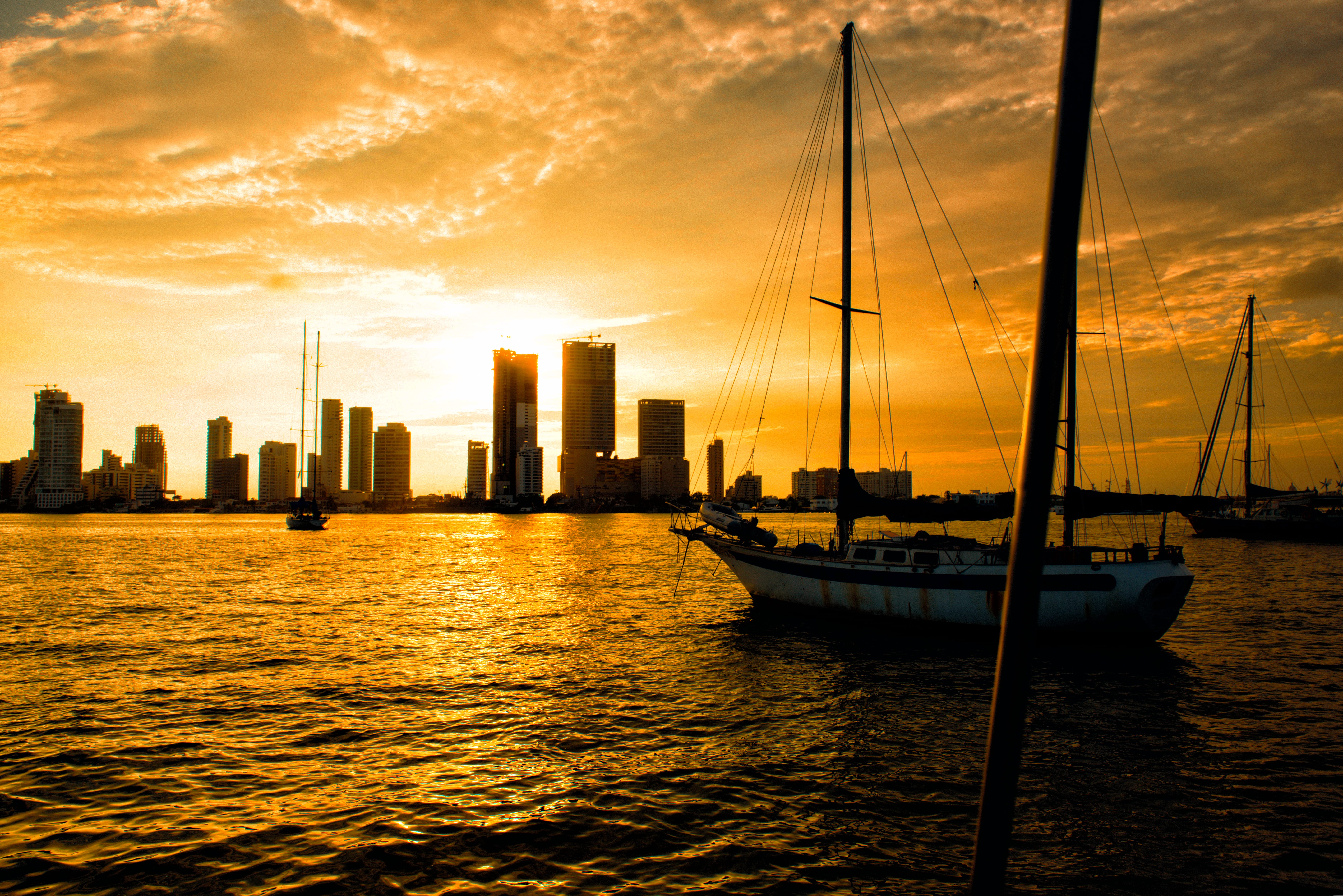 waterfront, skyscraper, building exterior, sailboat, architecture, cartagena, sea, built structure, water, sun, transportation, 5K, nautical vessel, cityscape, HD Wallpaper