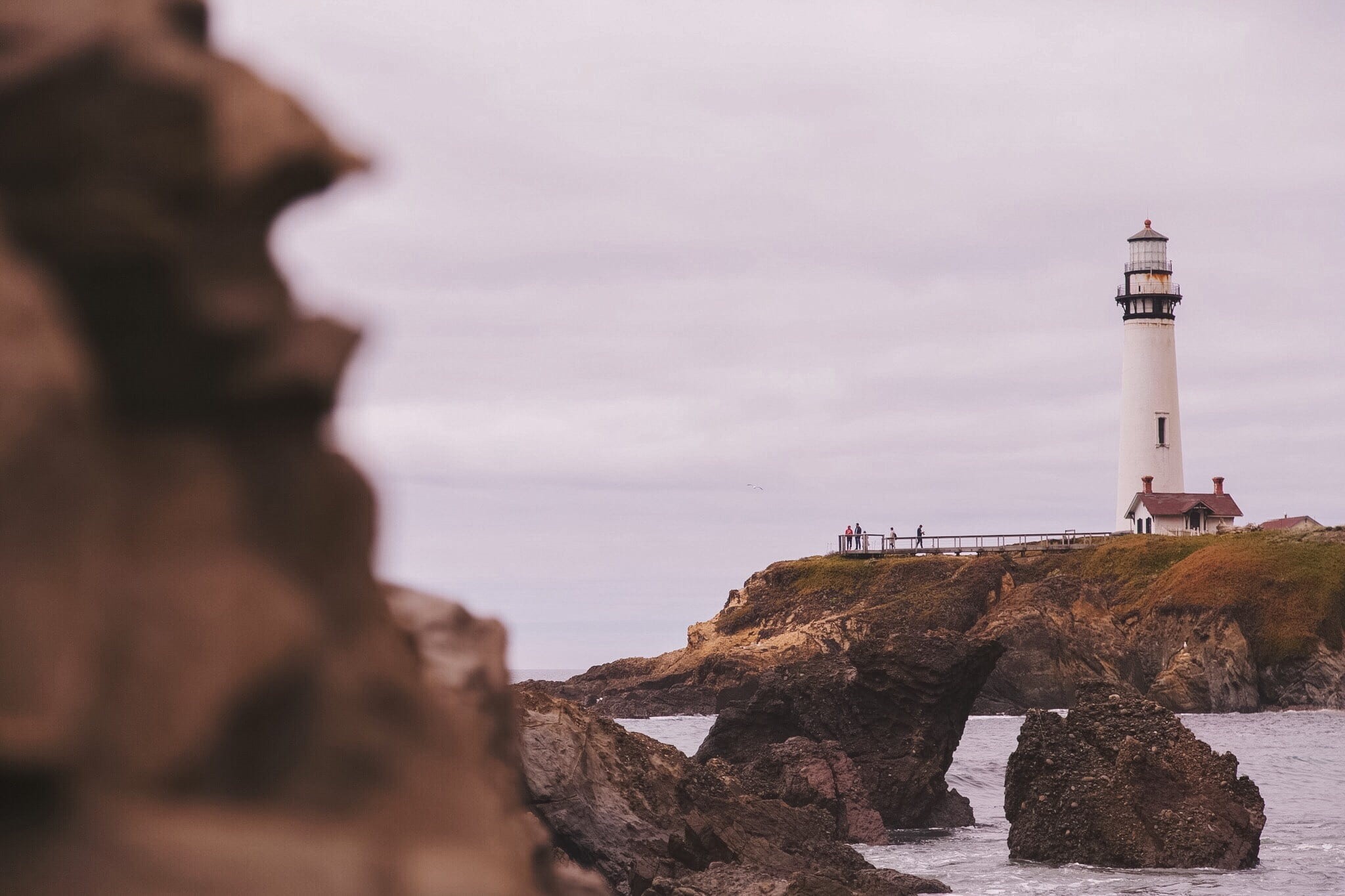 solid, outdoors, grey, sea, rock - object, built structure, land, atop, landscape, tower, white, rock, coast, security, ocean, weather, water, no people, HD Wallpaper