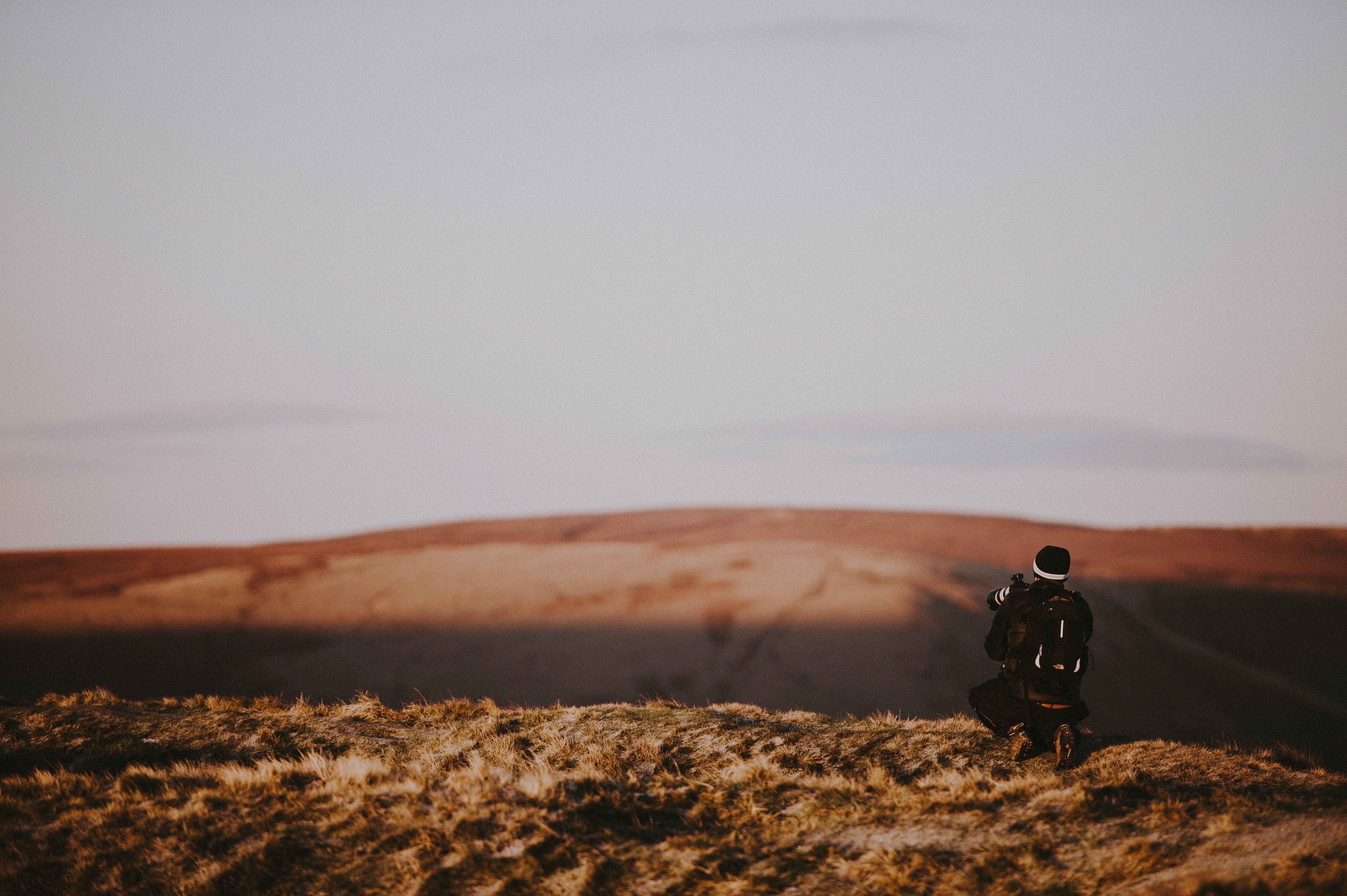 leisure activity, cloud - sky, copy space, atop, environment, photographer, grass, land, 4K, one person, man, mam, scenics - nature, kneeling, men, landscape, HD Wallpaper