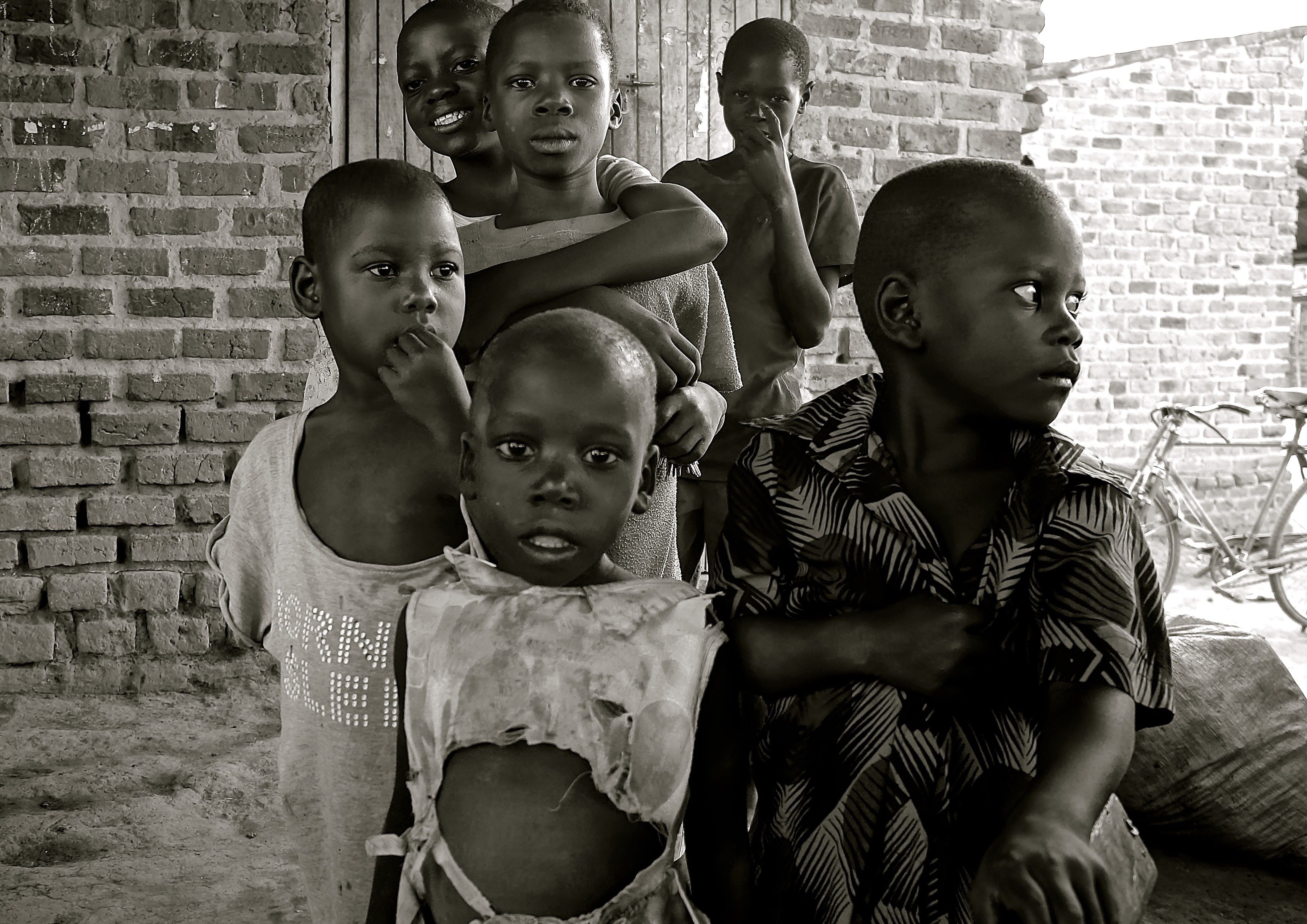 innocence, looking at camera, child, girls, leisure activity, sister, real people, Africa, 4K, brick wall, portrait, bonding, males, grayscale, family, HD Wallpaper