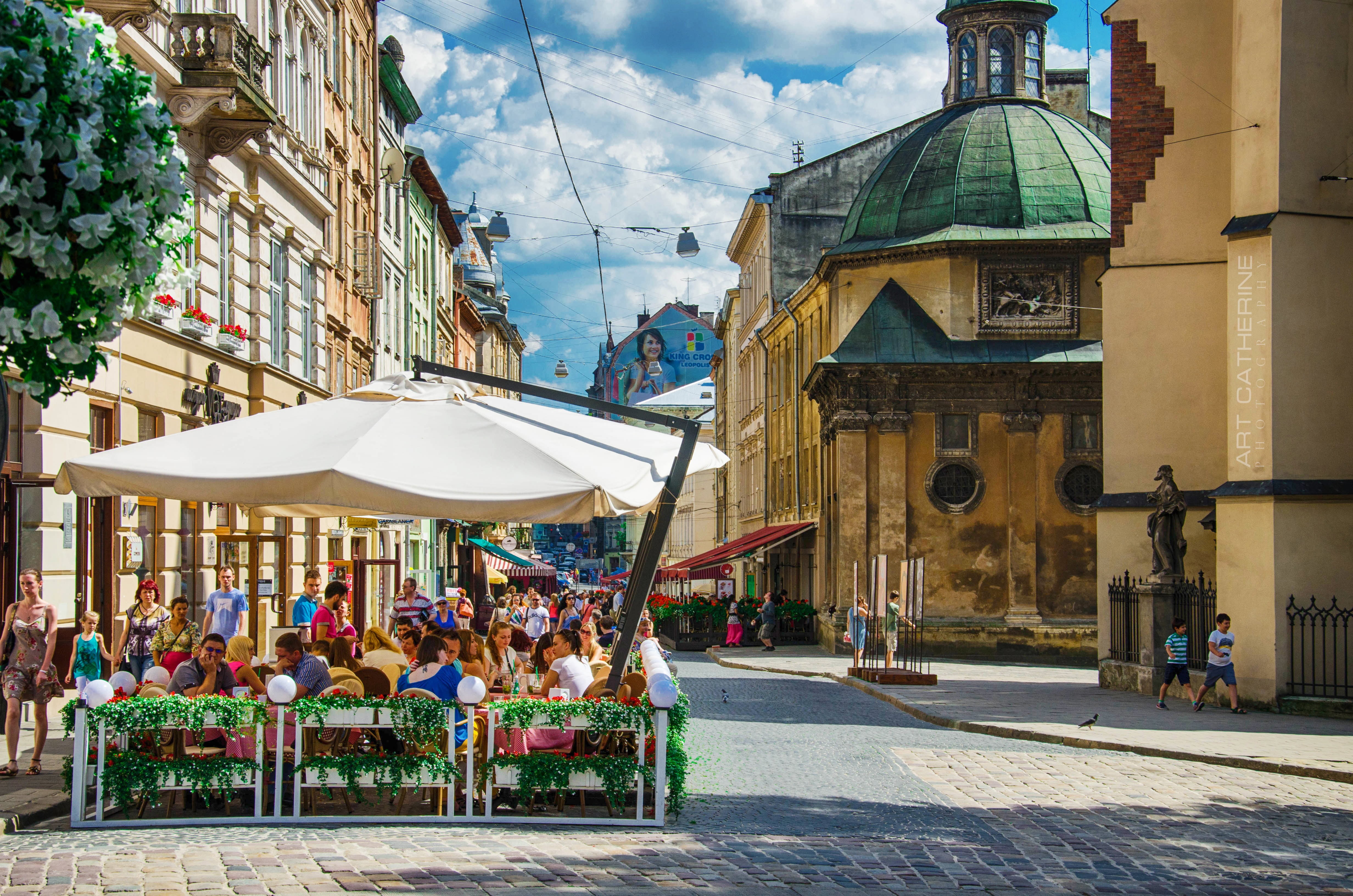 adult, restaurant, place of worship, sidewalk cafe, table, cultures, seat, street, people, city, cityscape, urban Scene, built Structure, cloud - sky, house, HD Wallpaper