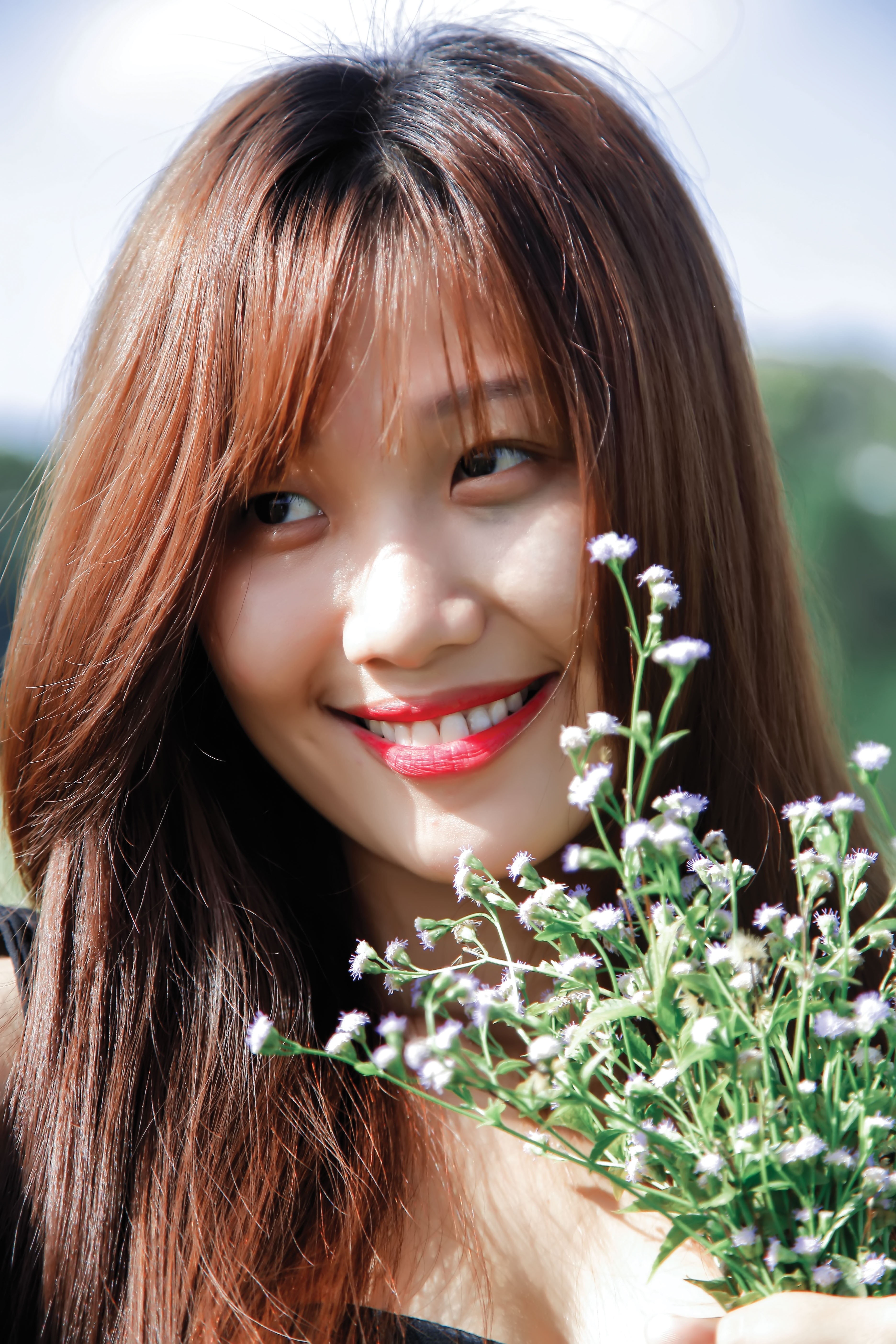 flowers, portrait, happiness, face, holding, smiling, model, one woman only, adults only, hair, nature, lifestyles, long hair, young, looking at camera, Phone HD Wallpaper