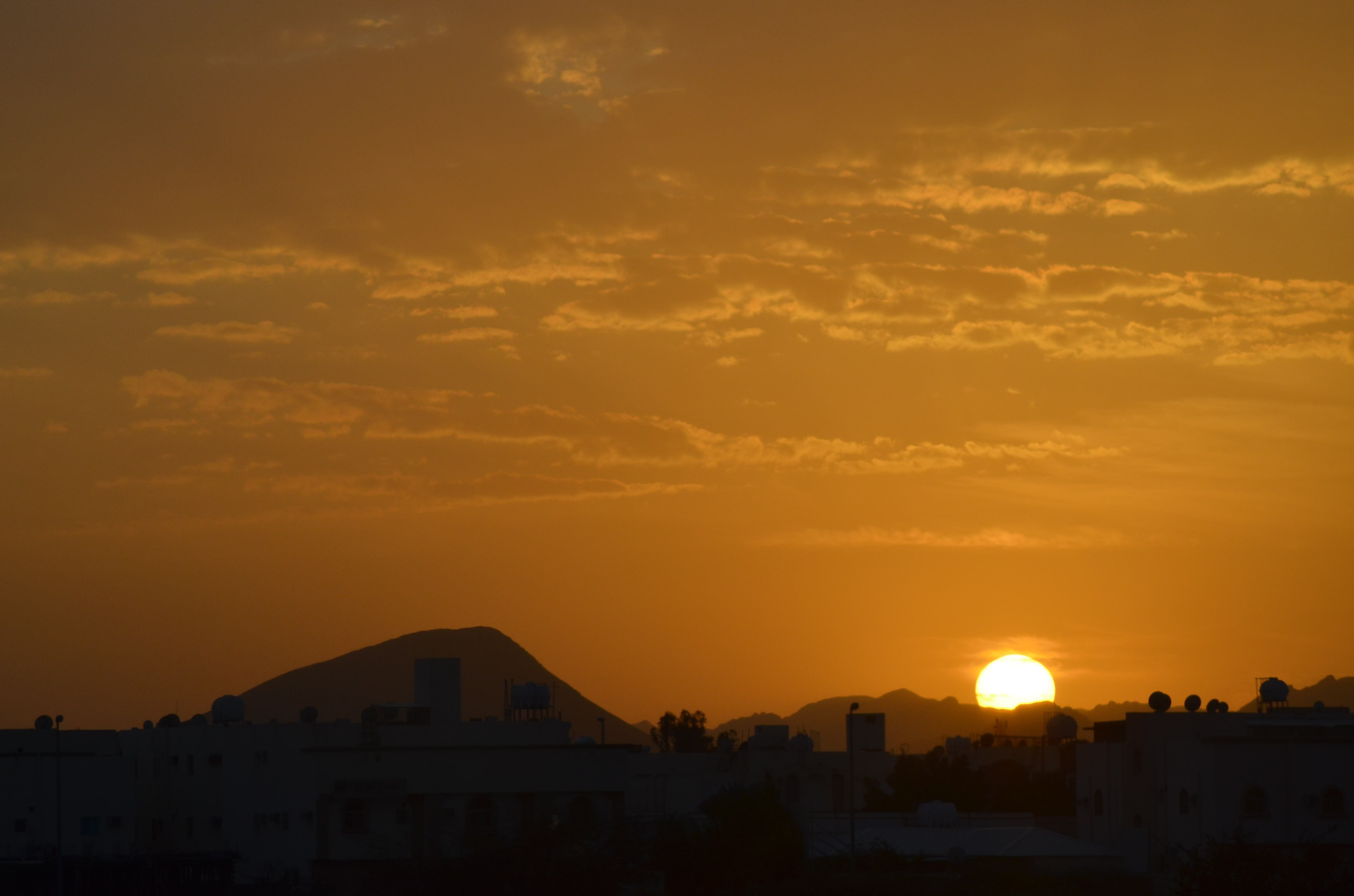 set, built structure, city, 4K, sky, orange color, scenics - nature, mountain, sun, silhouette, cloud - sky, architecture, sunset, sunlight, beauty in nature, HD Wallpaper
