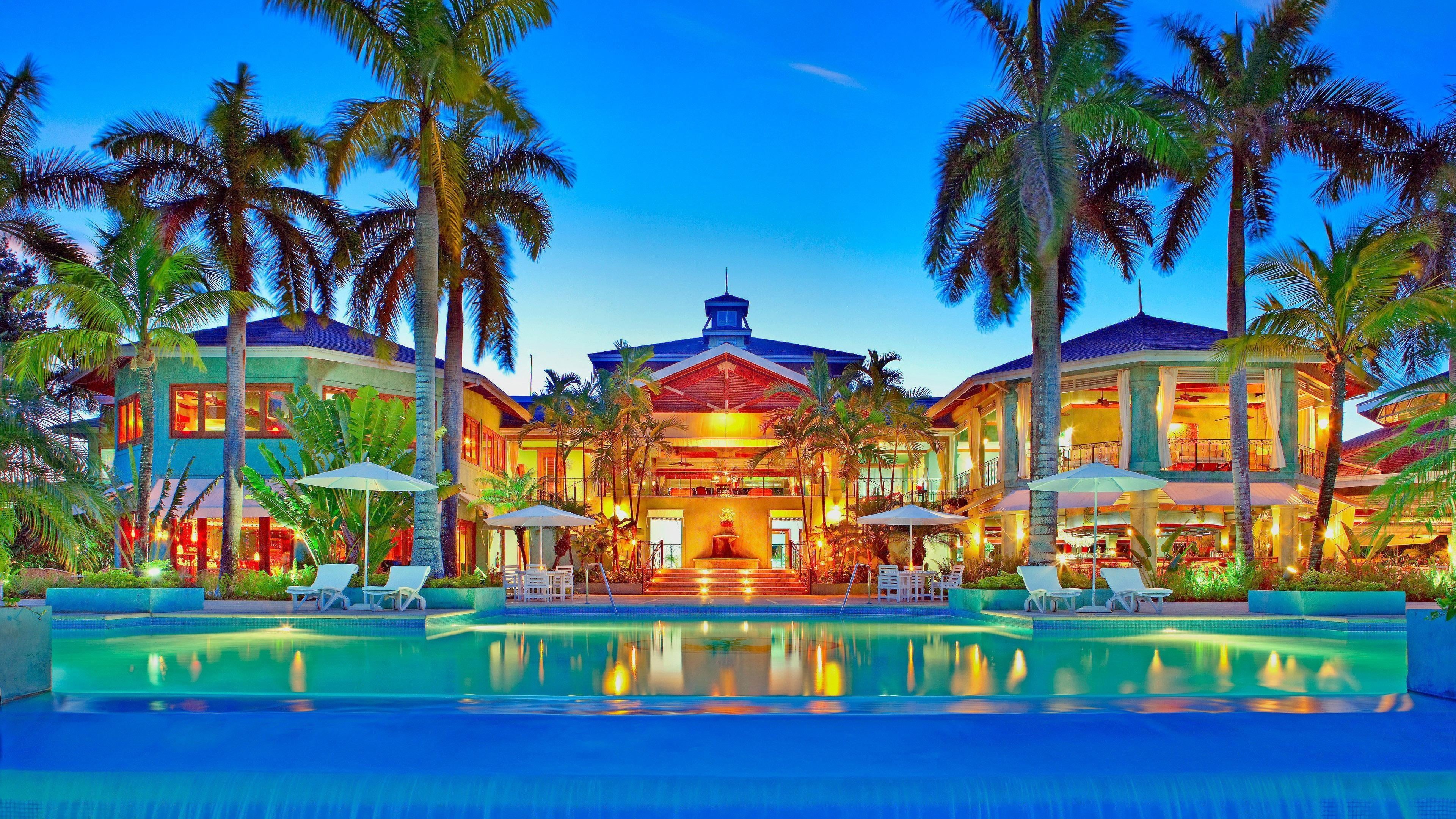 caribbean, palm tree, 4K, no people, tree, blue, swimming pool, nature, plant, luxury, water, holiday, travel destinations, building exterior, tropical, HD Wallpaper
