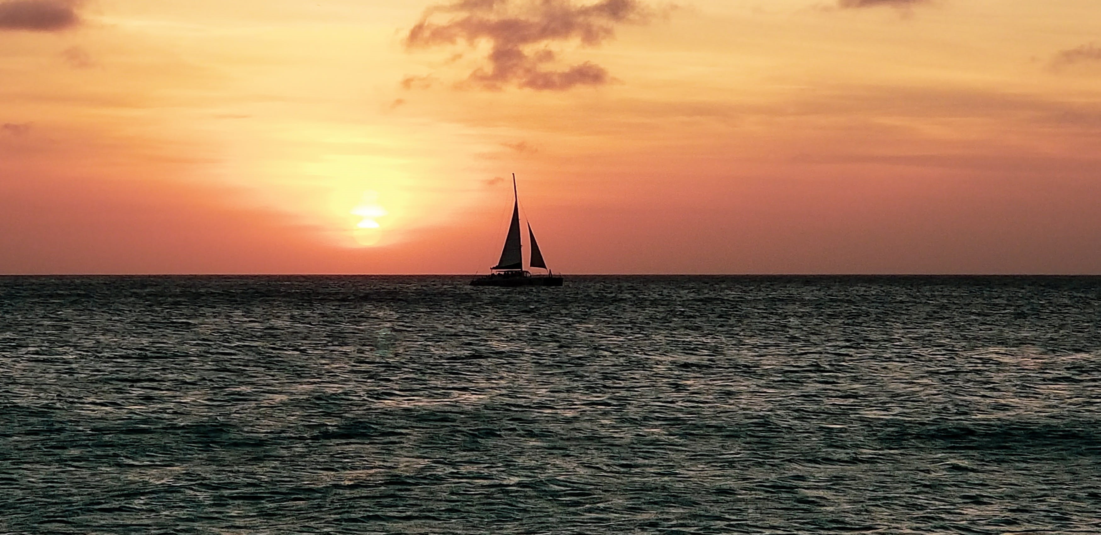 aruba, travel, 2K, scenics - nature, sea, ocean, luxury, sunset, nature, yachting, tranquil scene, idyllic, no people, nautical vessel, sailing, horizon, HD Wallpaper