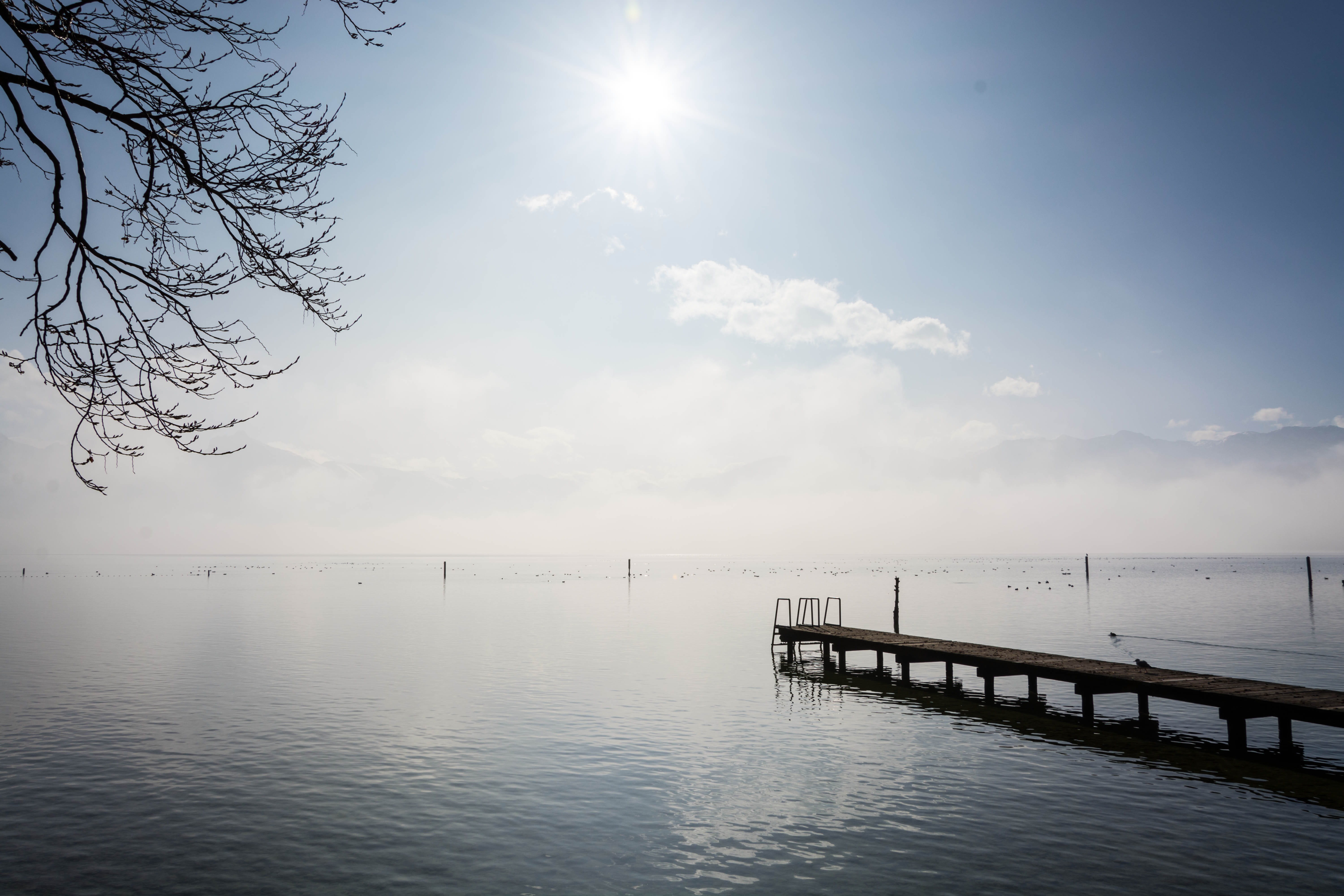 no people, sunlight, 5K, beauty in nature, alpine, non-urban scene, sun, mirroring, quiet, horizon, lake, water, bright, sky, cold, light, bridge, idyllic, HD Wallpaper