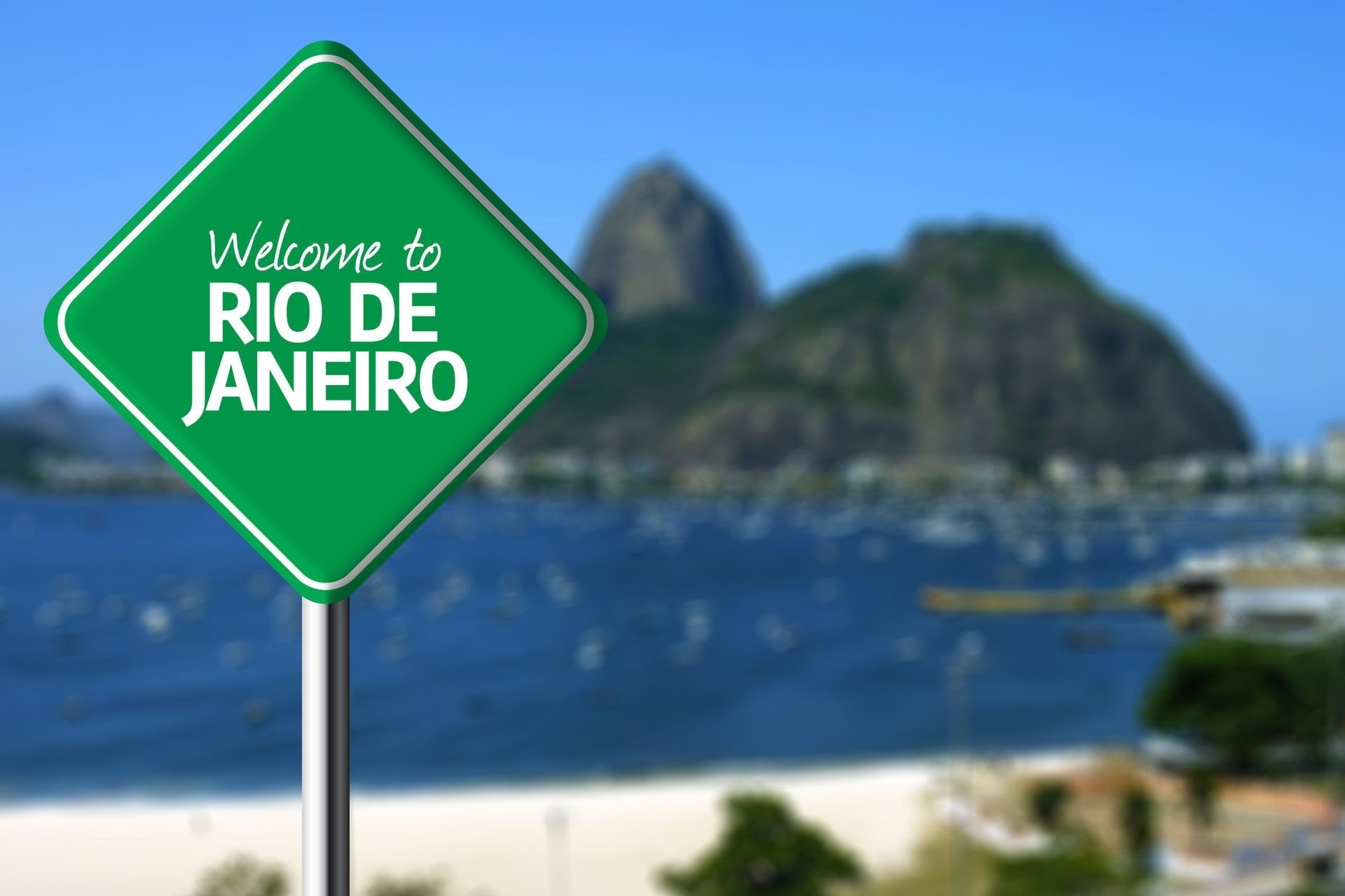 western script, road, travel destinations, road sign, trees, blue, day, blurred, sea, landscape, outdoors, signage, text, mountain, janeiro, water, sign, HD Wallpaper