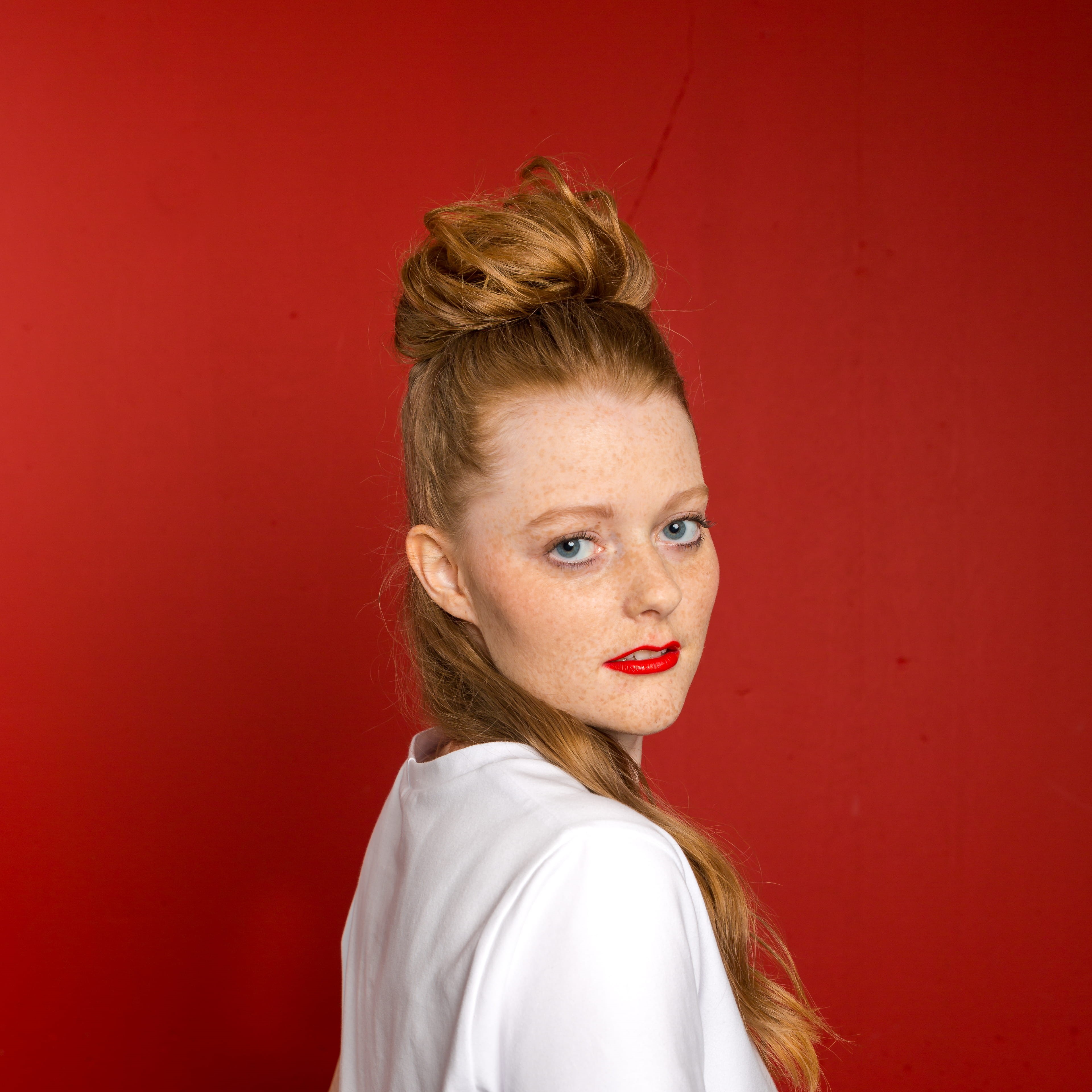 blond hair, hairstyle, adult, switzerland, human face, look, indoors, red, studio shot, modelface, look back, cute, lovely, red wall, face, portrait, blue eyes, Phone HD Wallpaper