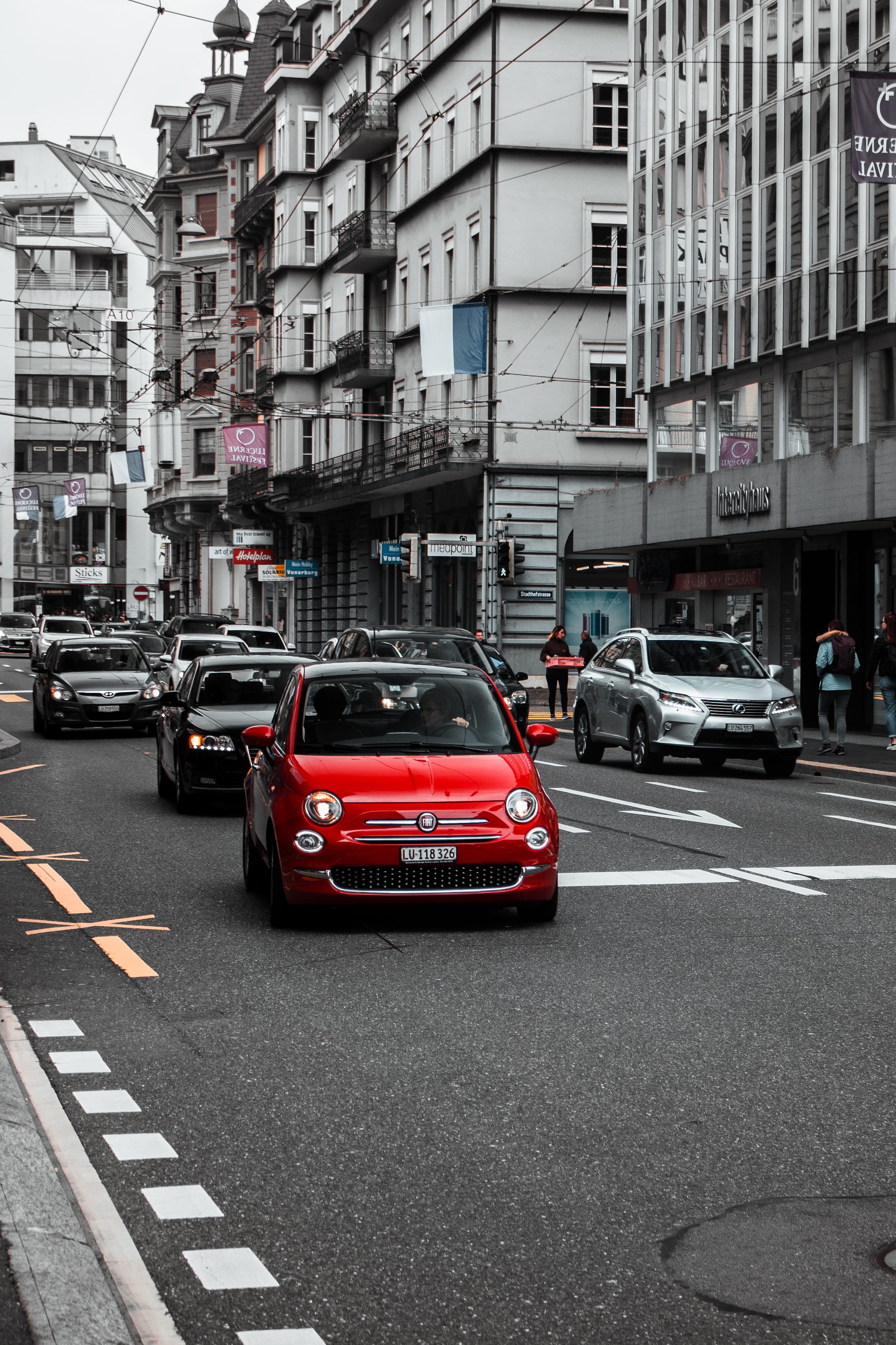 small, lucern, vehicle, incidental people, symbol, architecture, busy, tarmac, carphotography, city street, mini, sign, way, marking, road marking, built structure, Phone HD Wallpaper