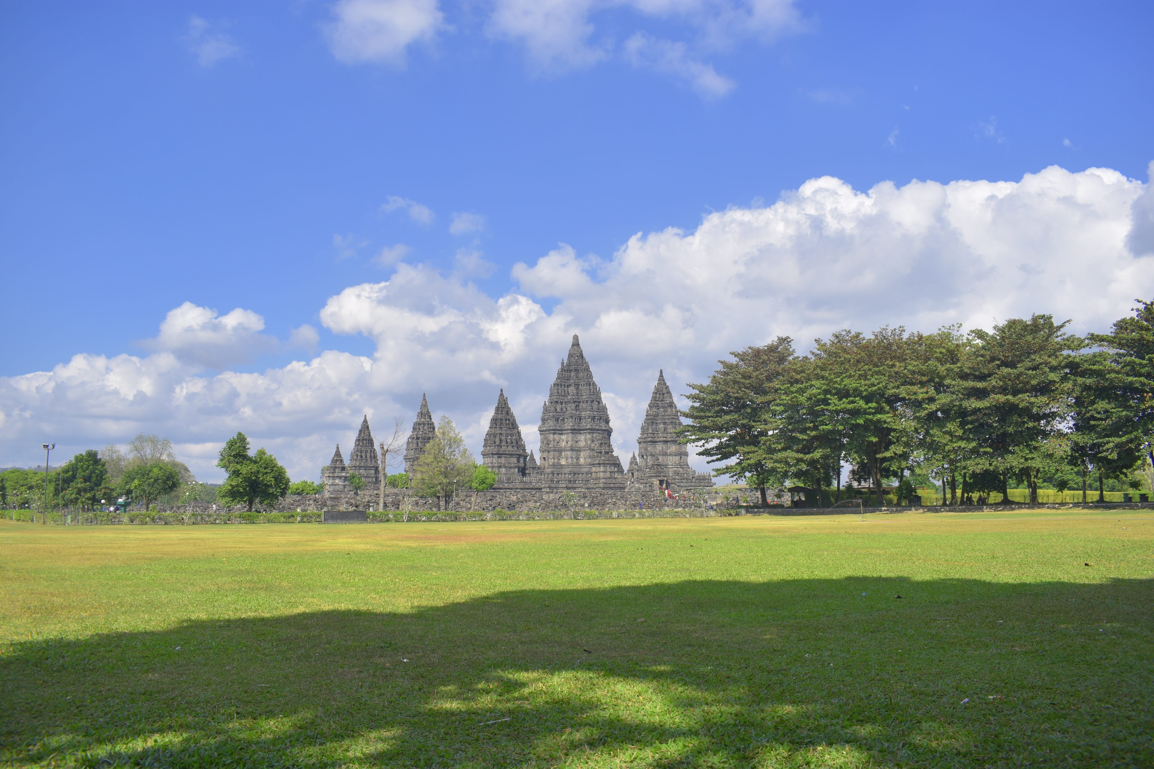 architecture, no people, outdoors, java, 4K, place of worship, sunlight, spirituality, prambanan, temple, grass, built structure, nature, building exterior, HD Wallpaper