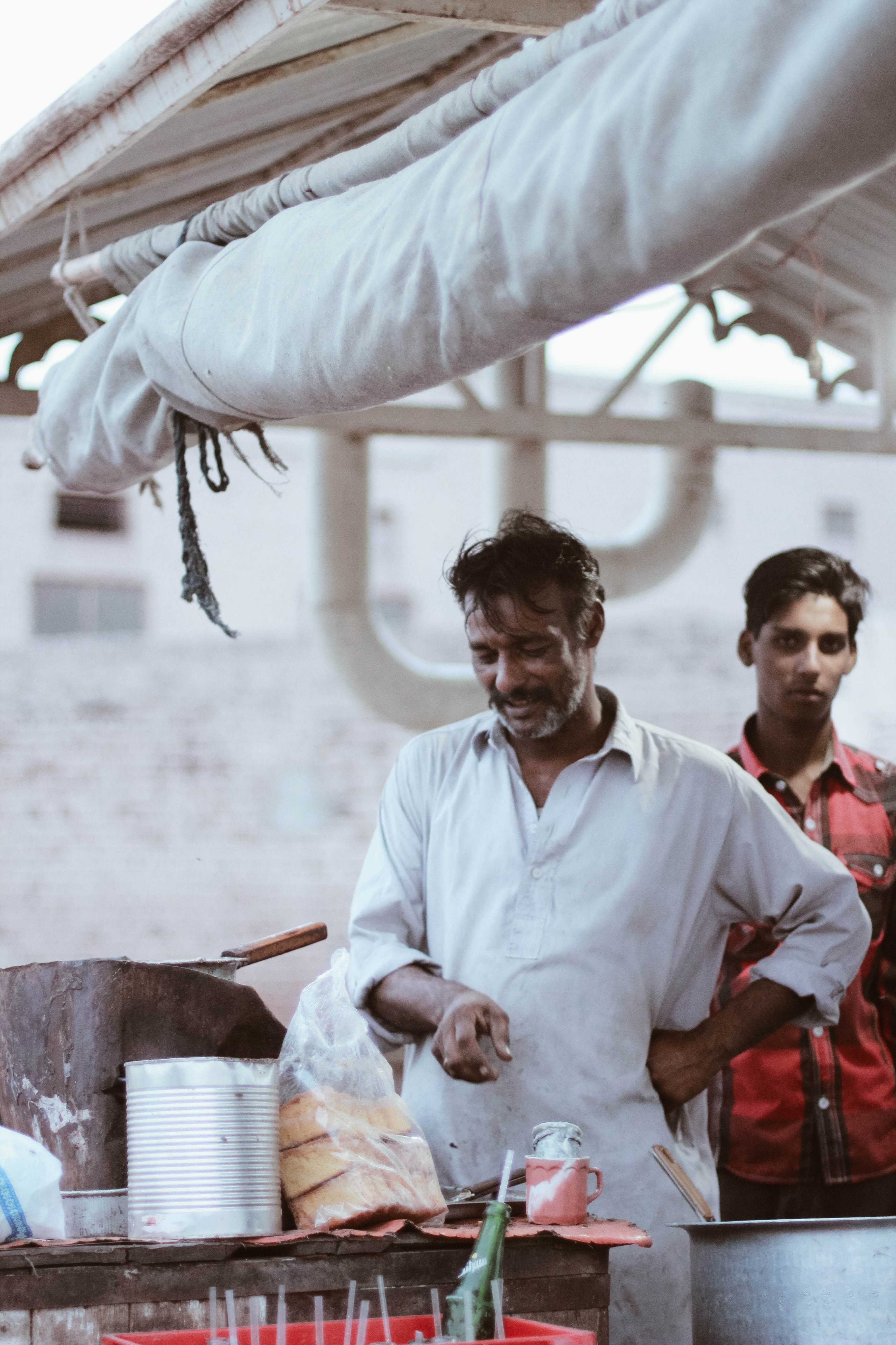 waist up, casual clothing, 5K, men, holding, chai walla, real people, emotion, multan, lost in streets, males, young adult, chaye wala, mid adult, people of pakistan, Phone HD Wallpaper