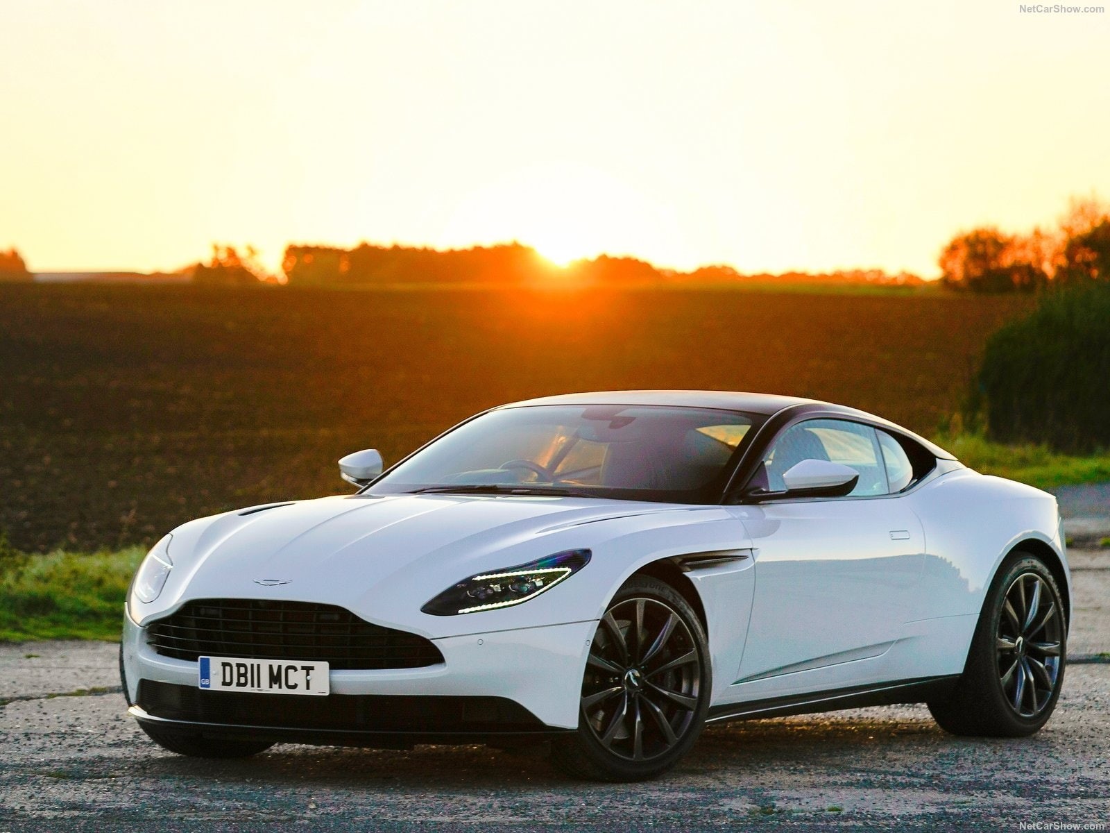sunlight, no people, 720P, wealth, Aston Martin, mode of transportation, land vehicle, luxury, road, shiny, copy space, DB 11 V8, sunset, leaving, outdoors, HD Wallpaper