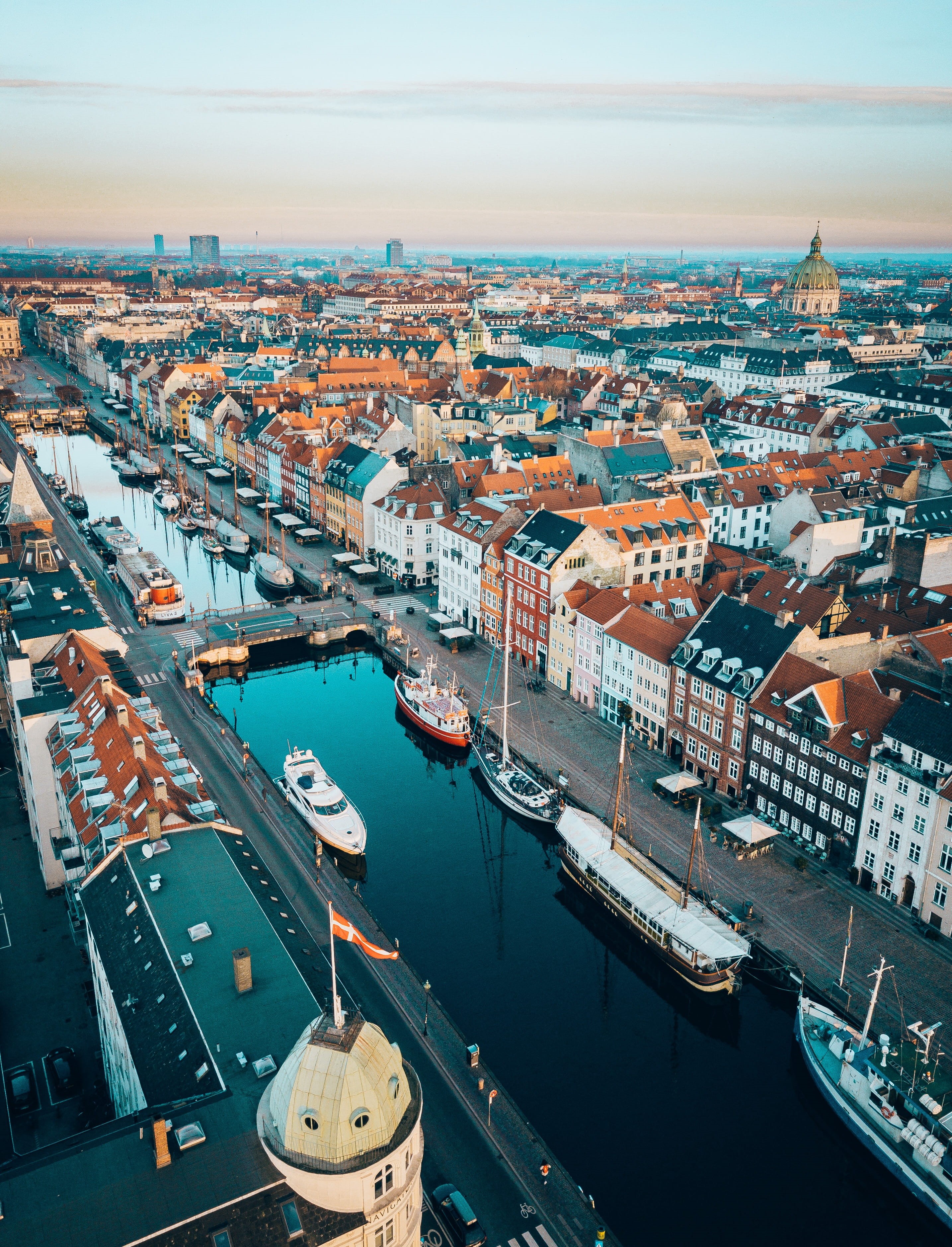 city, flag, nautical vessel, architecture, cityscape, aerial view, residential district, drone, old, river, tourism, sky, port, transportation, urban, buildings, Phone HD Wallpaper