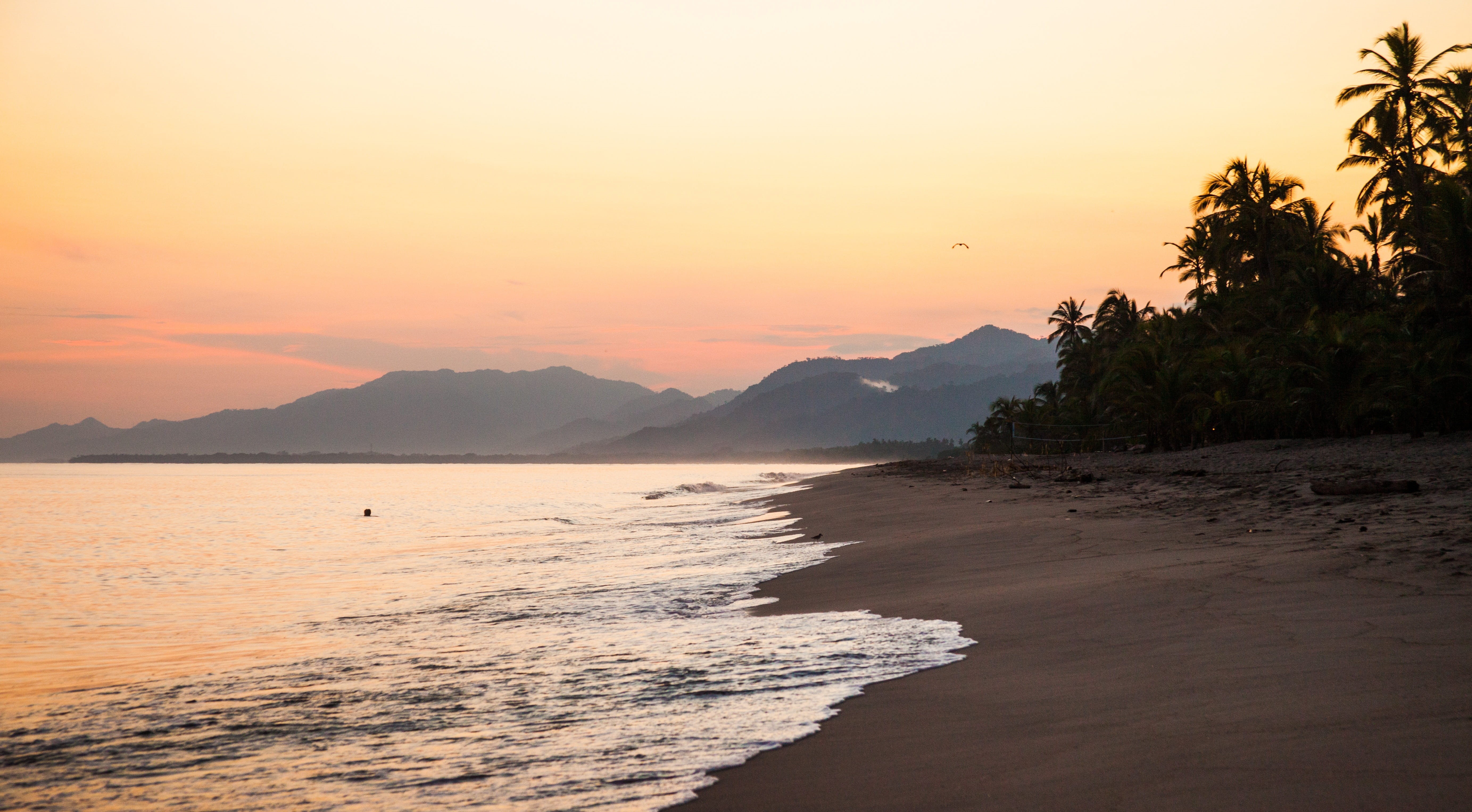 Beach, beauty in nature, water, orange, tree, tranquil scene, Sea, hill, idyllic, wave, Sunset, date, Holidays, scenics, colombia, sport, waves, palm, travel destinations, HD Wallpaper