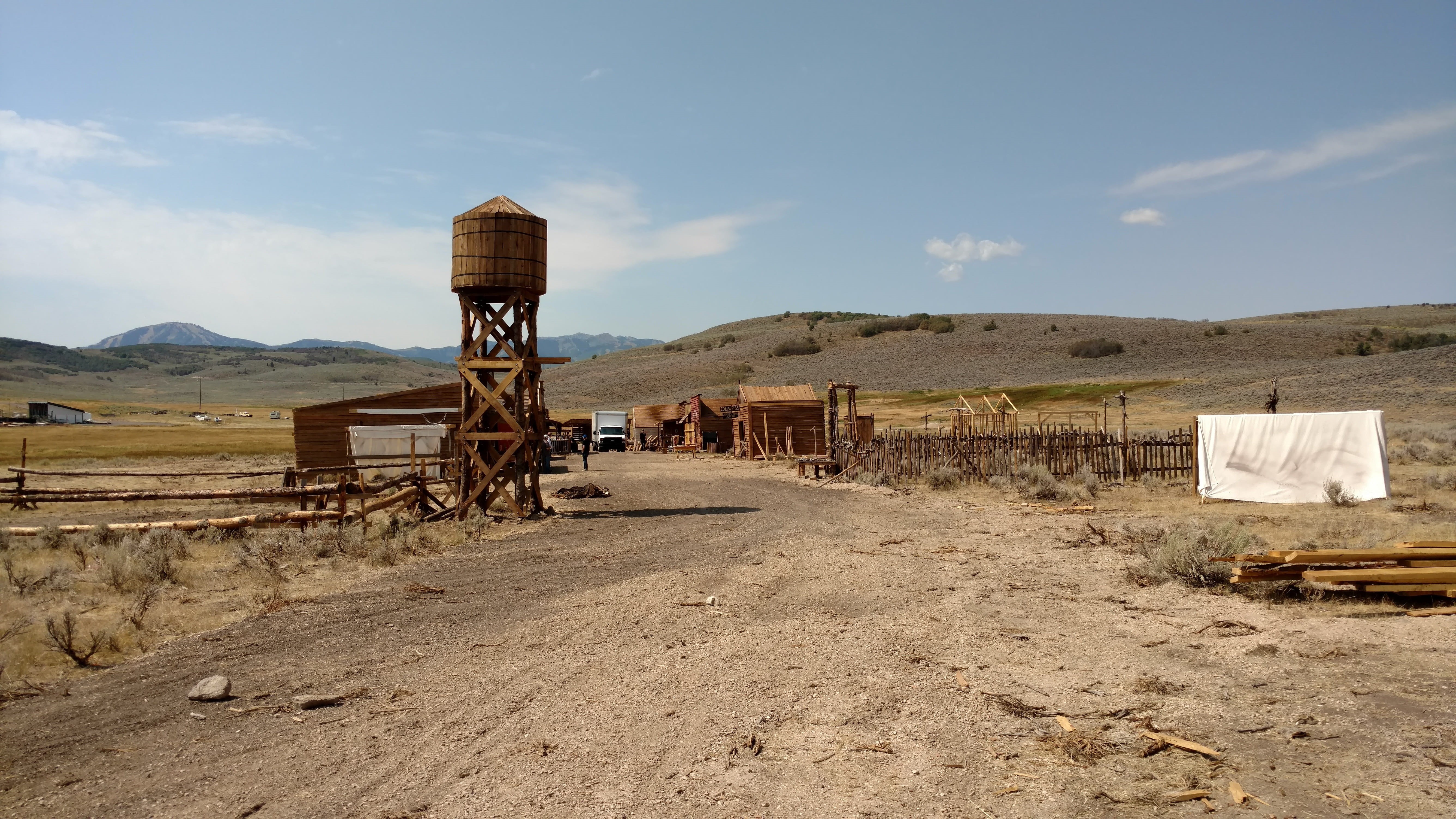 outdoors, field, Western, town entrance, desert, day, non-urban scene, agriculture, landscape, sky, old west, land, western movie set, dirt road, Movie, HD Wallpaper