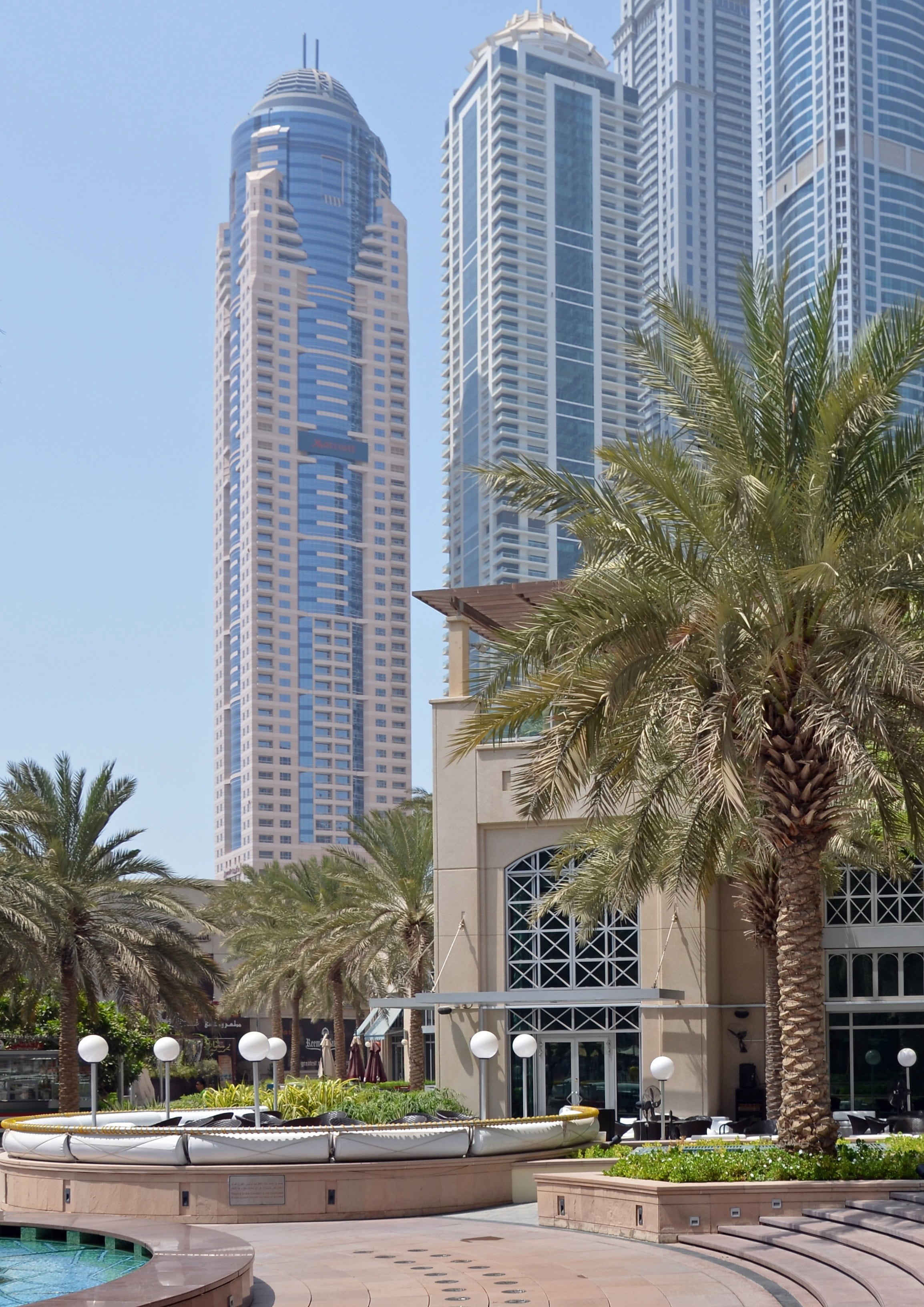 skyscrapers, city tour, 2K, tourists, tropical climate, sun, architecture, tower, skyscraper, building exterior, built structure, plant, day, coconut palm tree, Phone HD Wallpaper