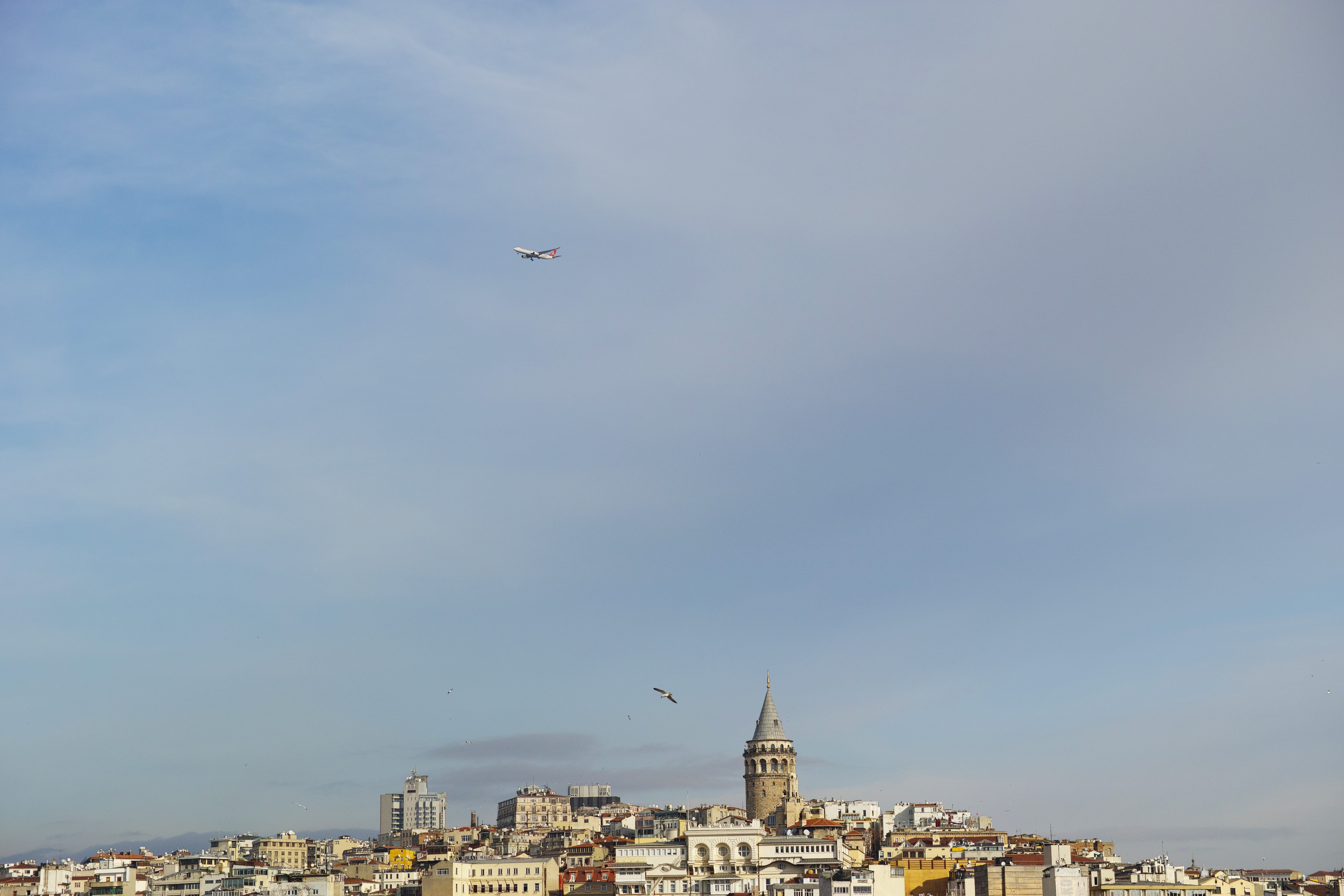 beautiful, airplane, flying, background, cityscape, building, cloud, transportation, outdoors, building exterior, islam, historical works, mid-air, townscape, HD Wallpaper