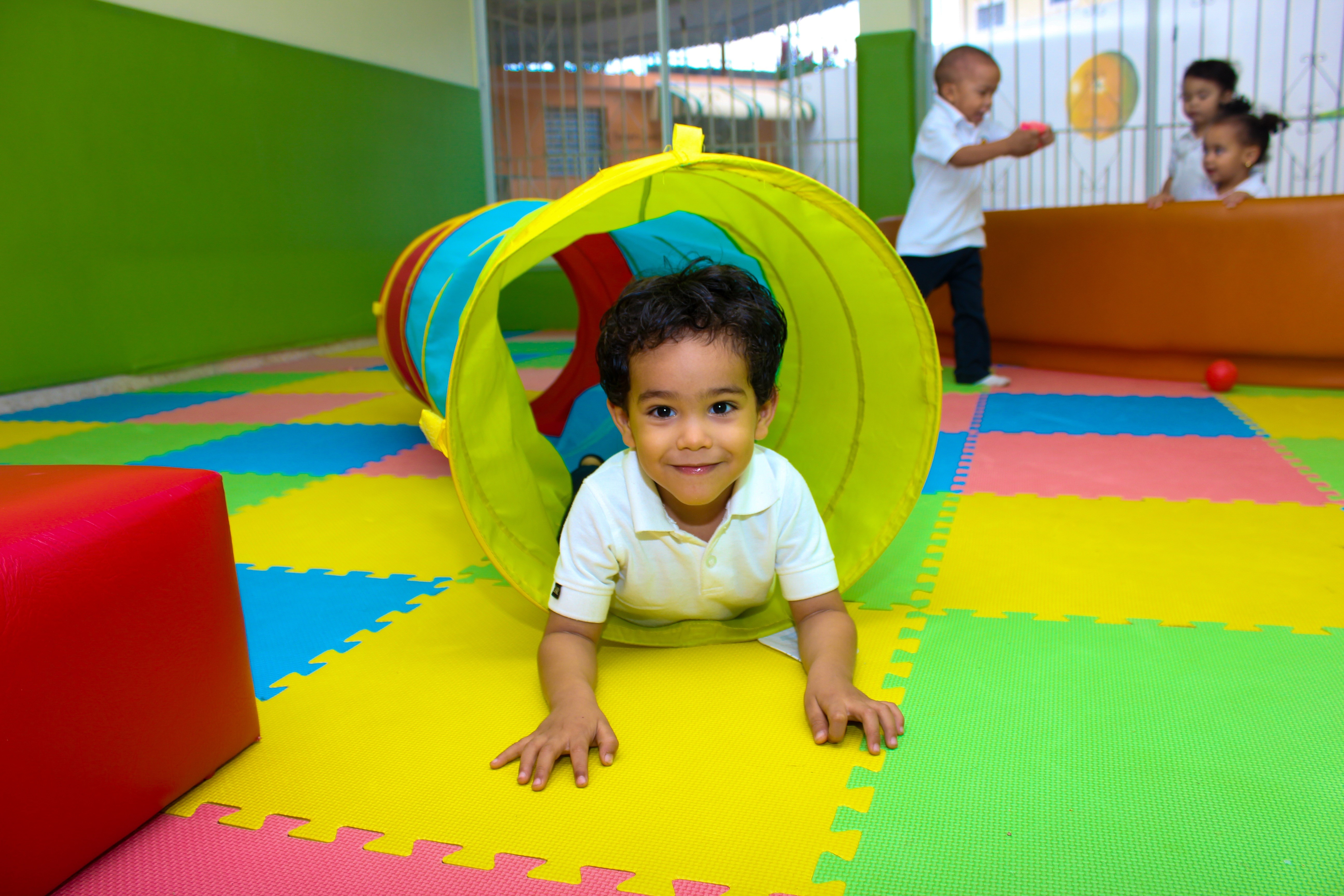 preschool Building, boy, enjoying, childhood, preschool, happiness, front view, lying, child, play, colors, boys, people, multi colored, school, fun, males, HD Wallpaper