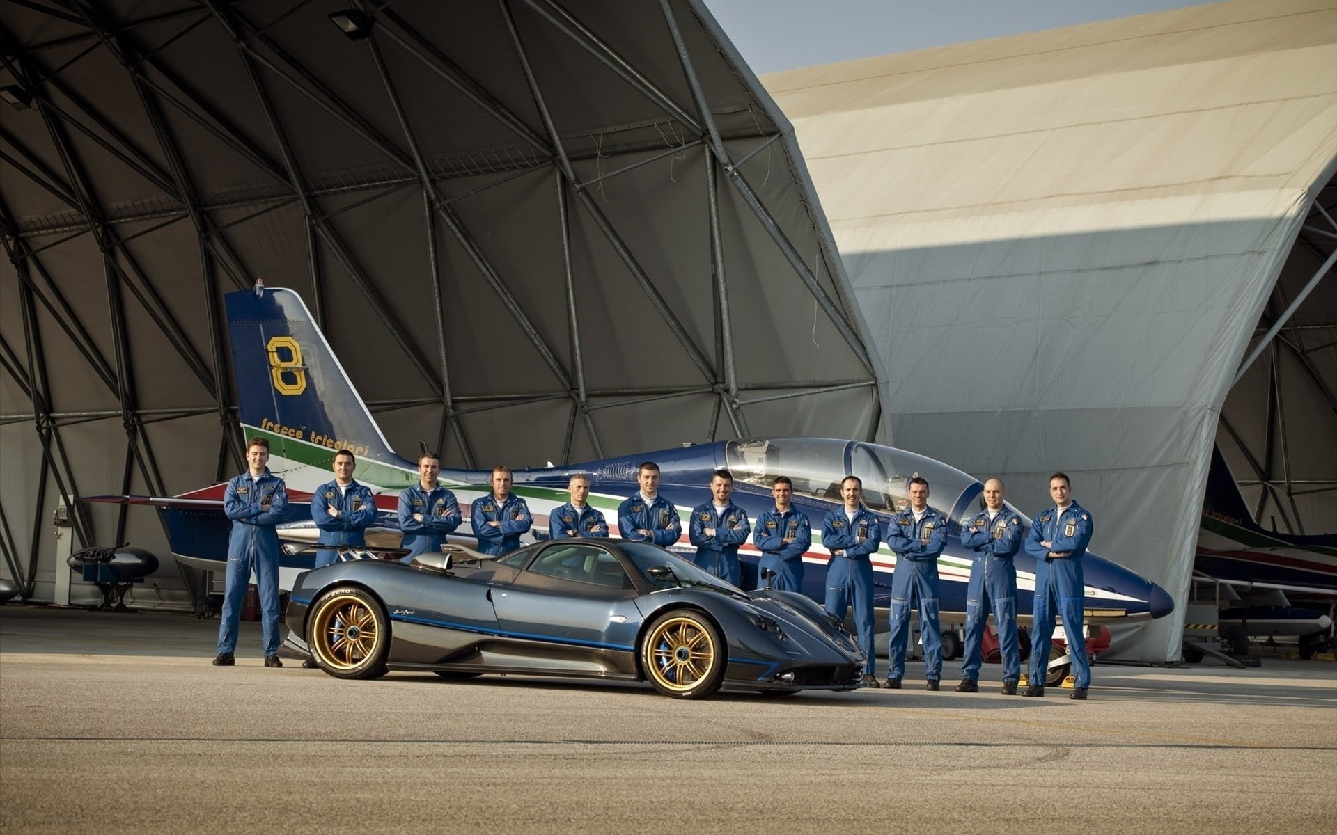 1080P, land vehicle, uniform, long, helmet, built structure, outdoors, car, road, jumpsuit, Pagani Zonda Tricolore, real people, sleeved, architecture, HD Wallpaper