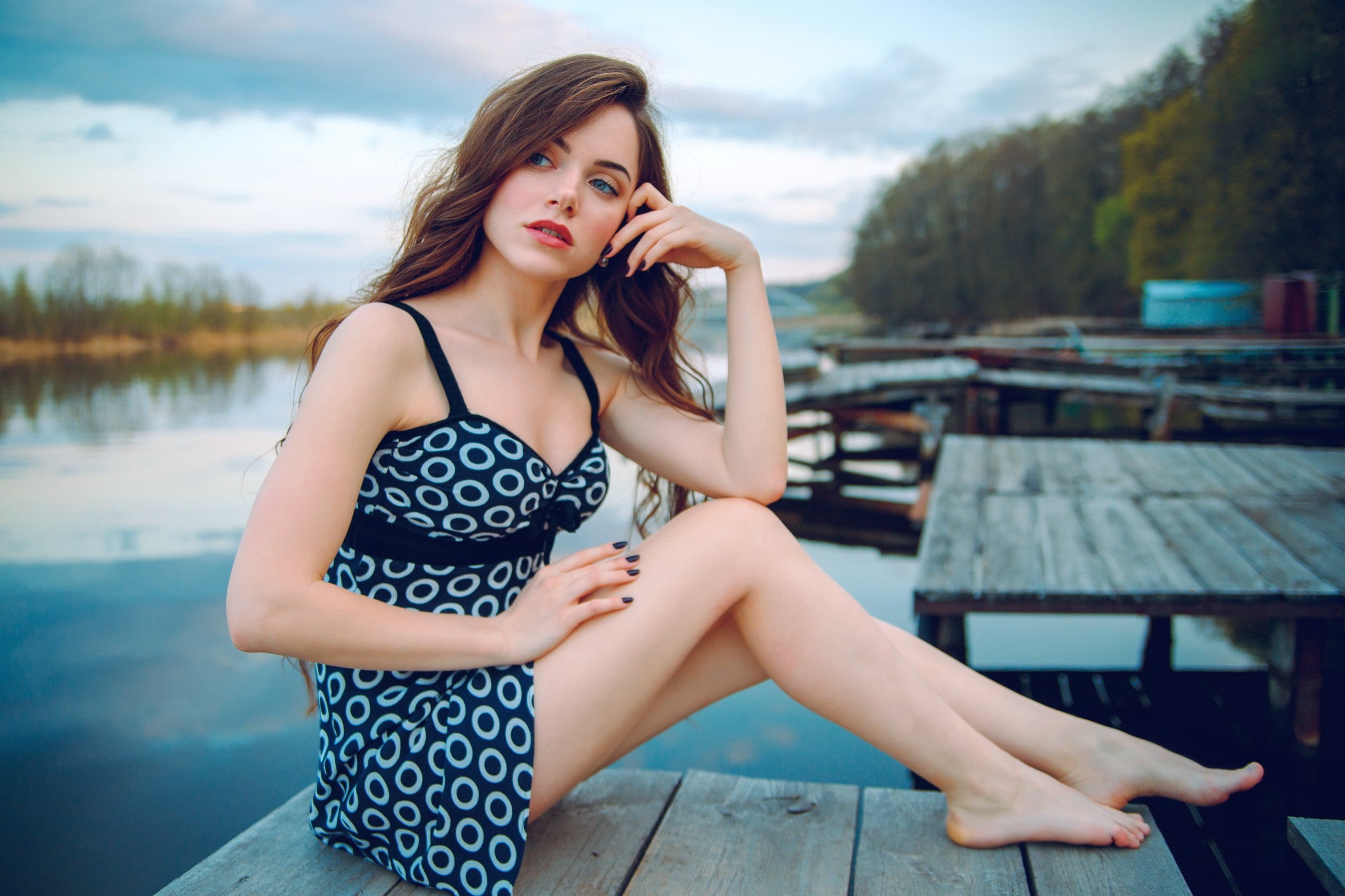 pale, minidress, blue eyes, touching face, photographer, bokeh, long hair, sitting, lake, brown hair, legs, Dmitry Yavr, depth of field, looking into the distance, HD Wallpaper