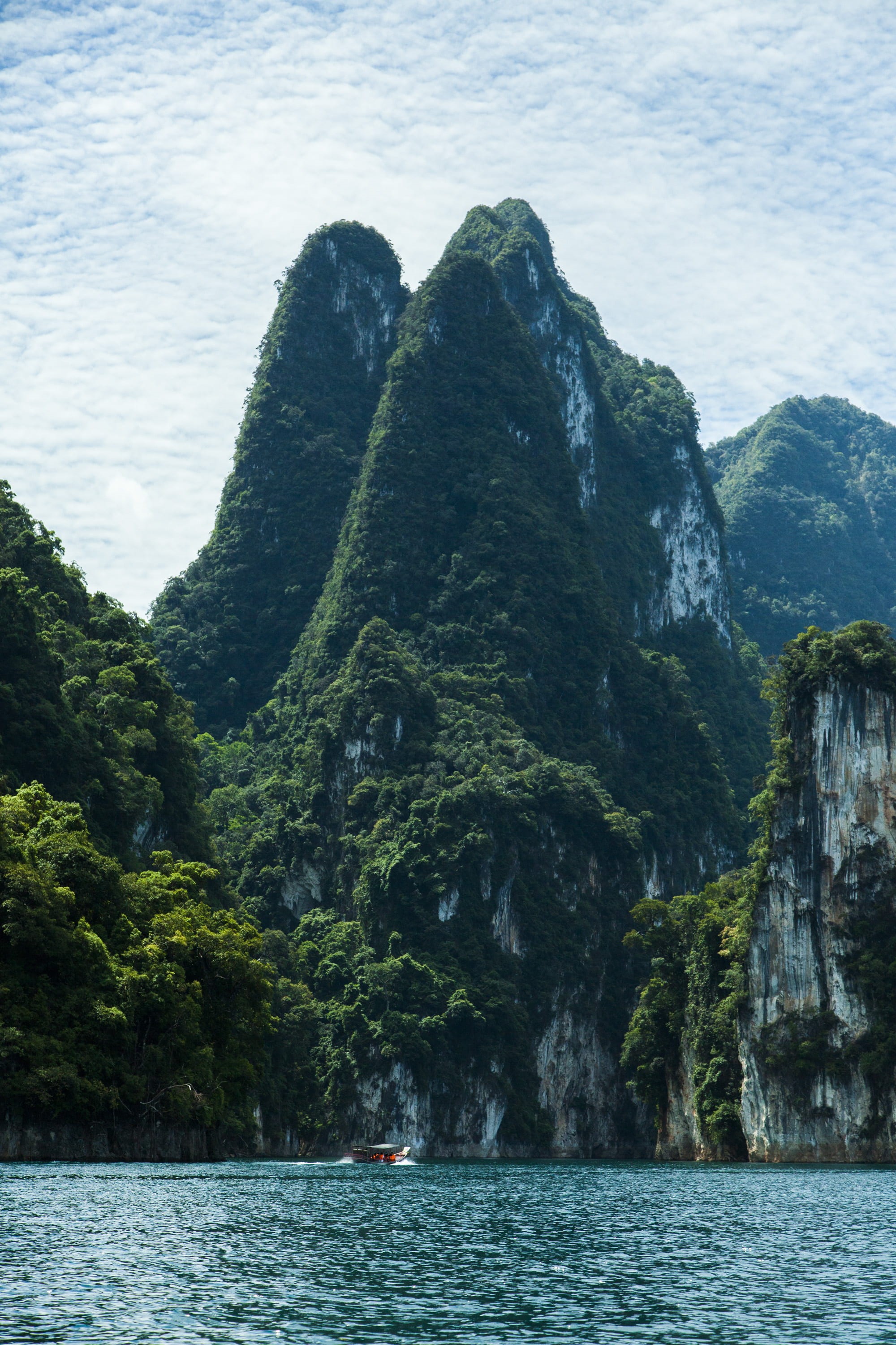 tranquility, island, sea, vacation, no people, mountain, rock, day, formation, outdoors, view, green color, clouds, mountain range, rock formation, nature, Phone HD Wallpaper