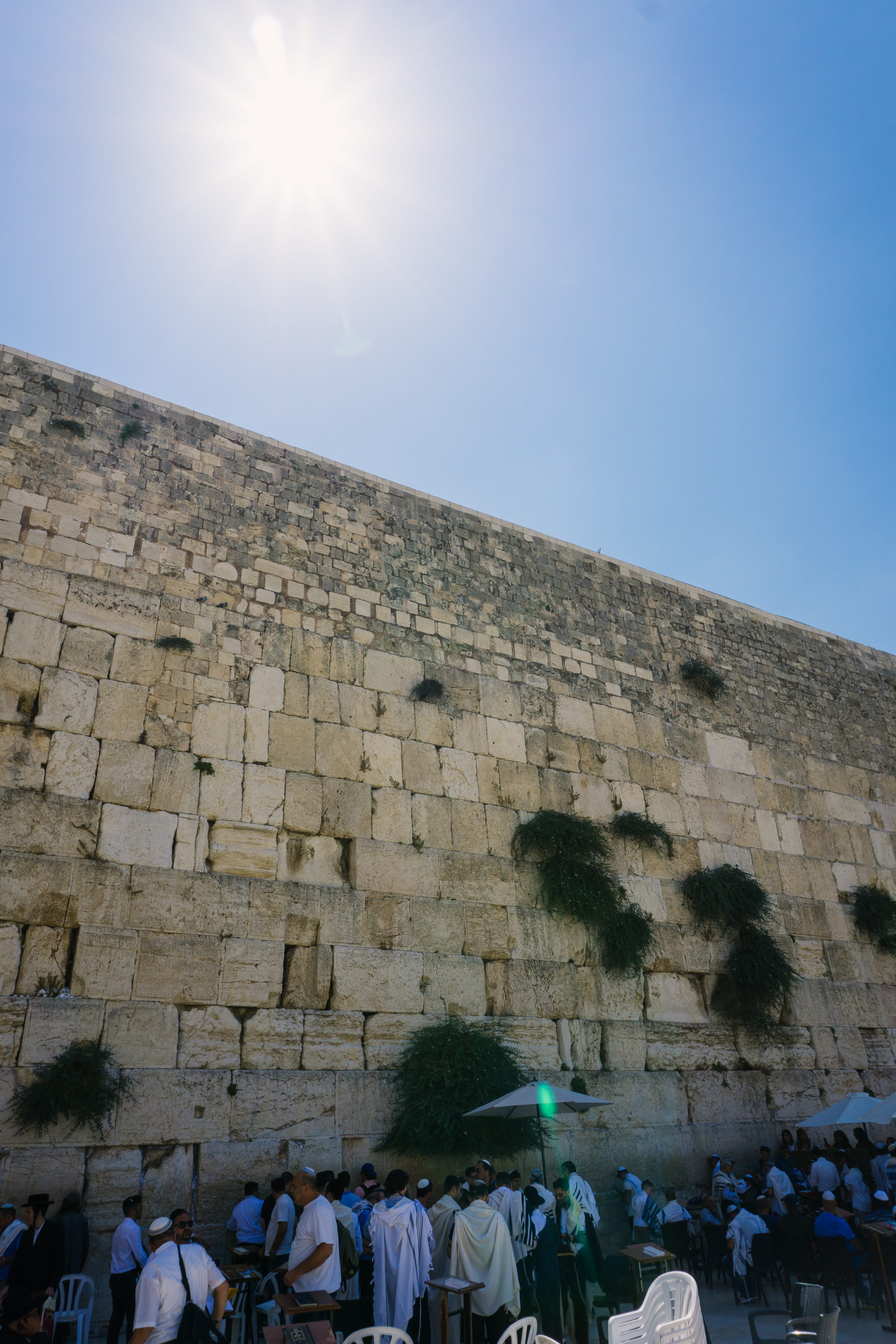 prayer, ancient civilization, 5K, women, history, sky, architecture, day, travel destinations, lens flare, sun, wall, lifestyles, ruins, real people, sunlight, Phone HD Wallpaper