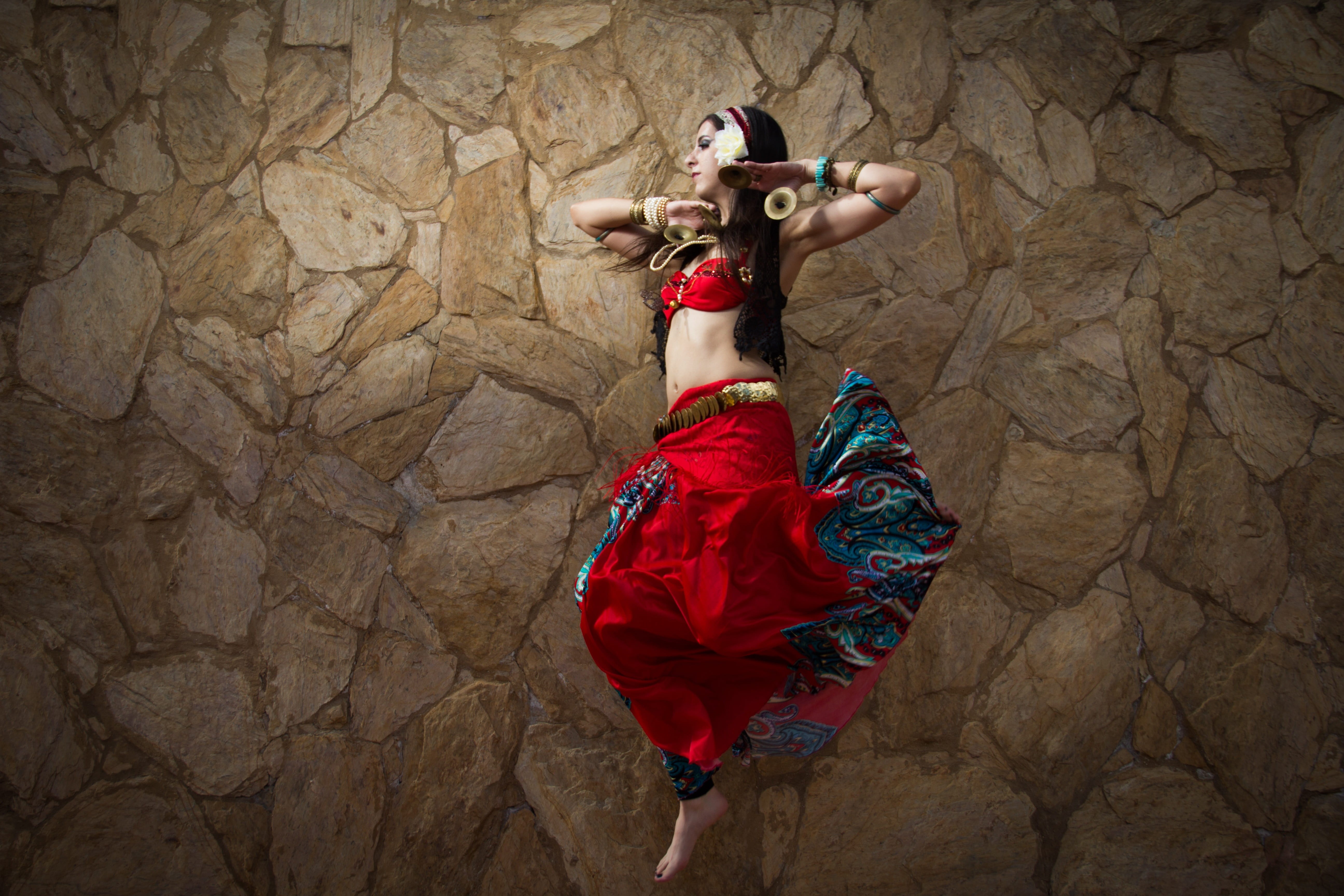 beautiful woman, rock, clothing, rock - object, jump, young adult, females, tribal, nature, beauty, skirt, one person, arabic, headwear, lifestyles, solid, HD Wallpaper