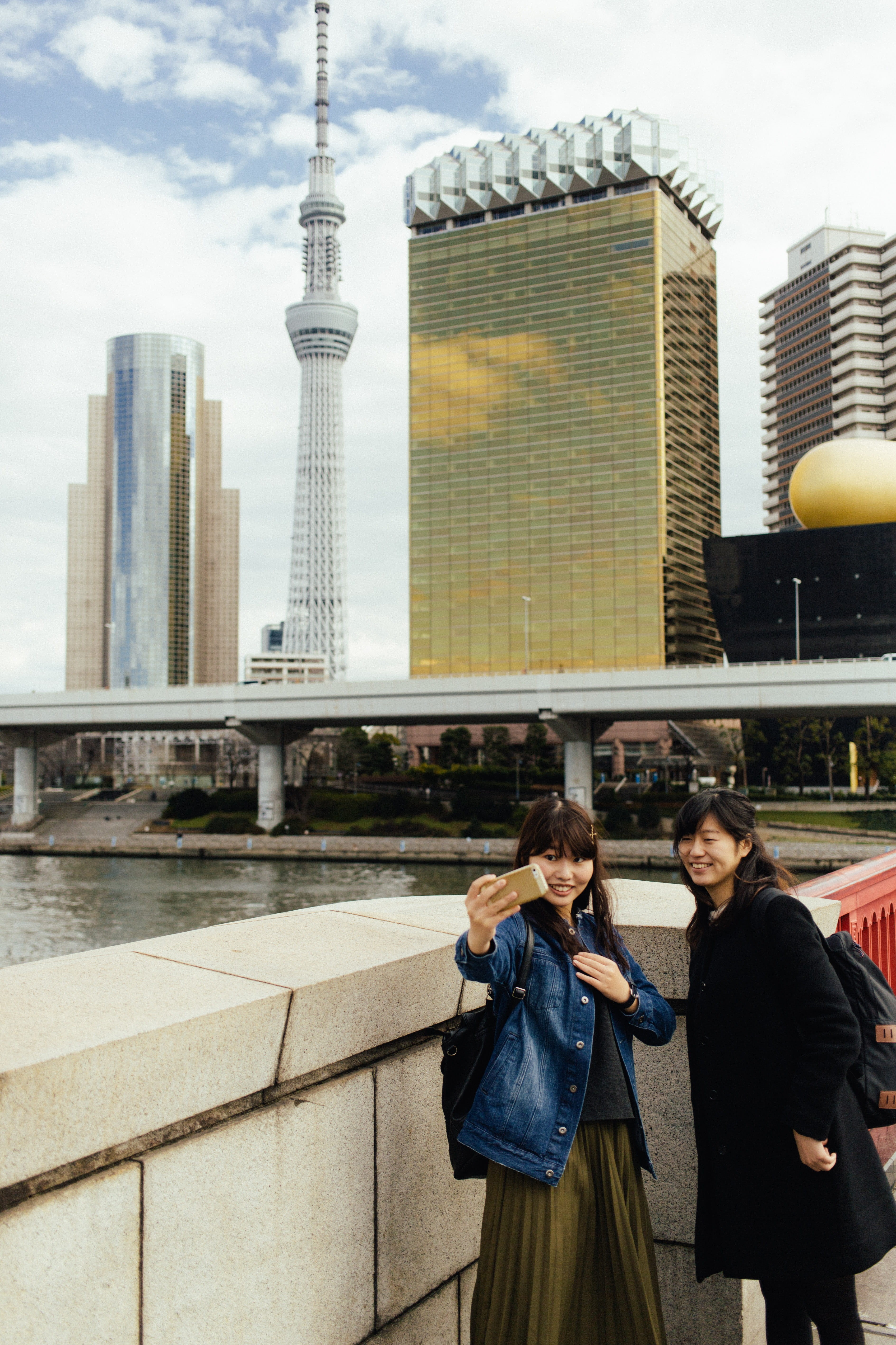 taito, 5K, sky, tall - high, asakusa, building exterior, casual clothing, skyscraper, gold, modern, outdoors, selfie, standing, tower, city, people, office building exterior, Phone HD Wallpaper
