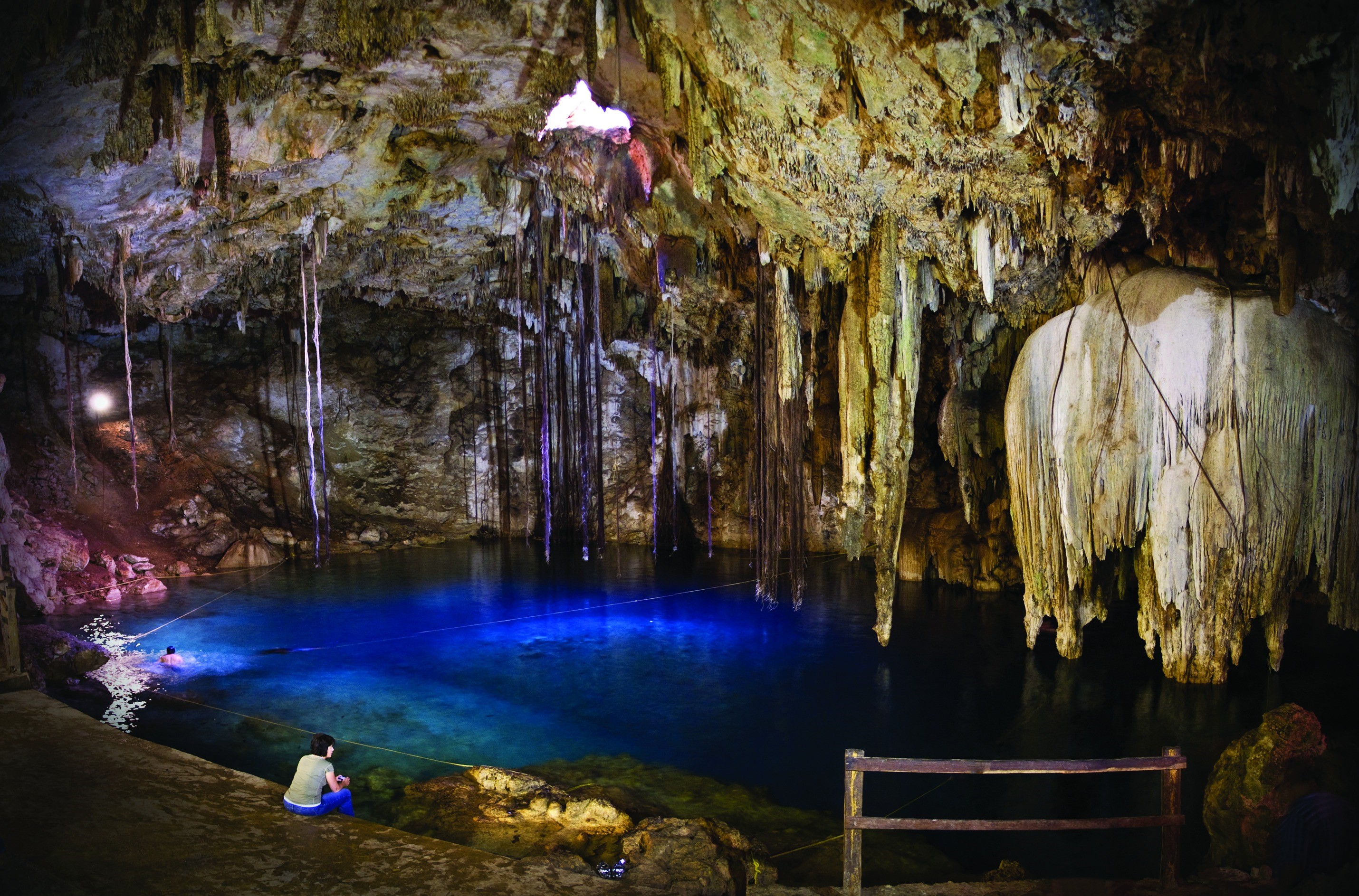 beauty in nature, real people, indoors, nature, solid, water, adult, women, leisure activity, rear view, illuminated, 2K, cave, person, one person, stalactite, HD Wallpaper