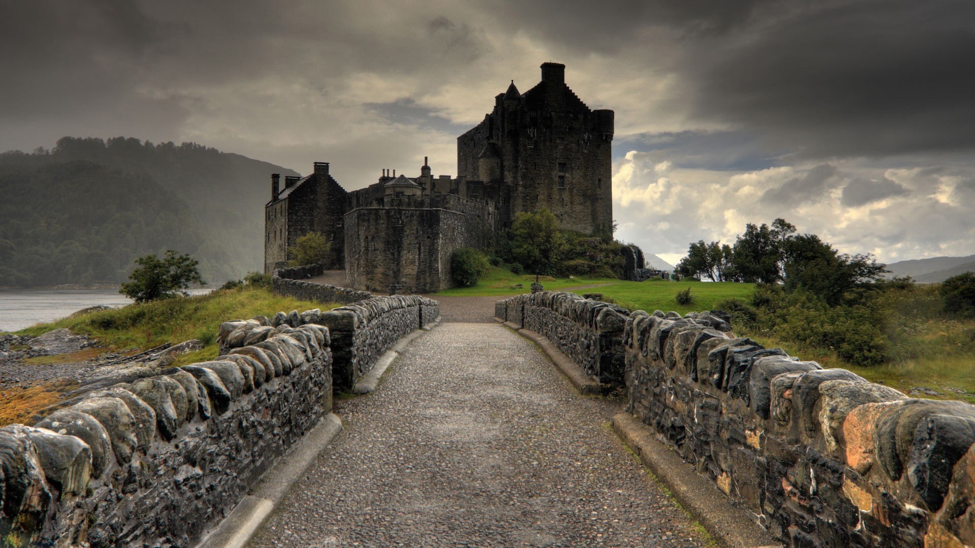 architecture, grass, UK, clouds, lake, hills, Eilean Donan, road, 1080P, trees, stones, landscape, forest, nature, water, rock, Scotland, castle, HD Wallpaper