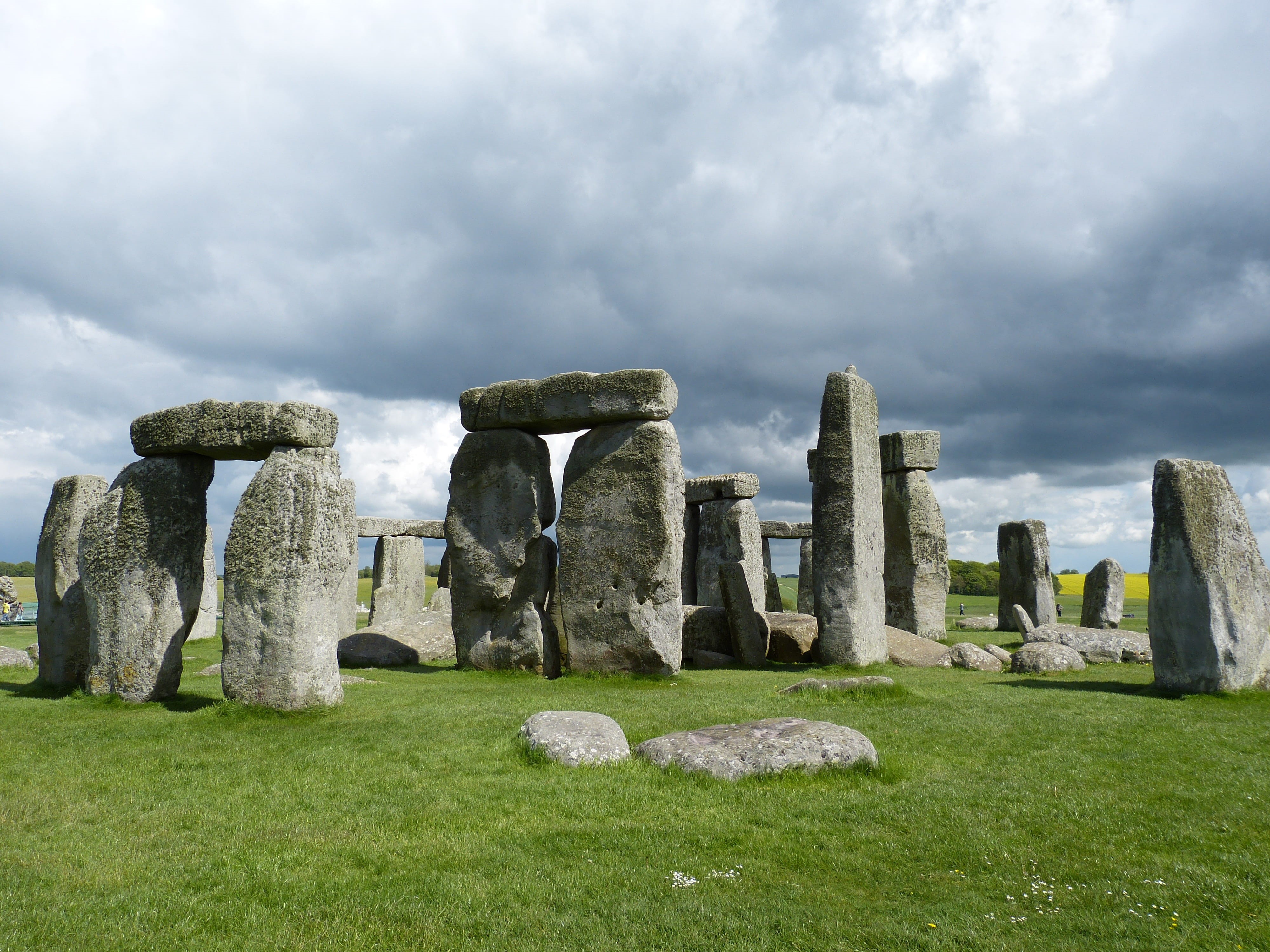 grass, stone material, united kingdom, ancient civilization, ruined, archaeology, tourism, old ruin, storm mood, ancient, sky, travel, cemetery, no people, HD Wallpaper