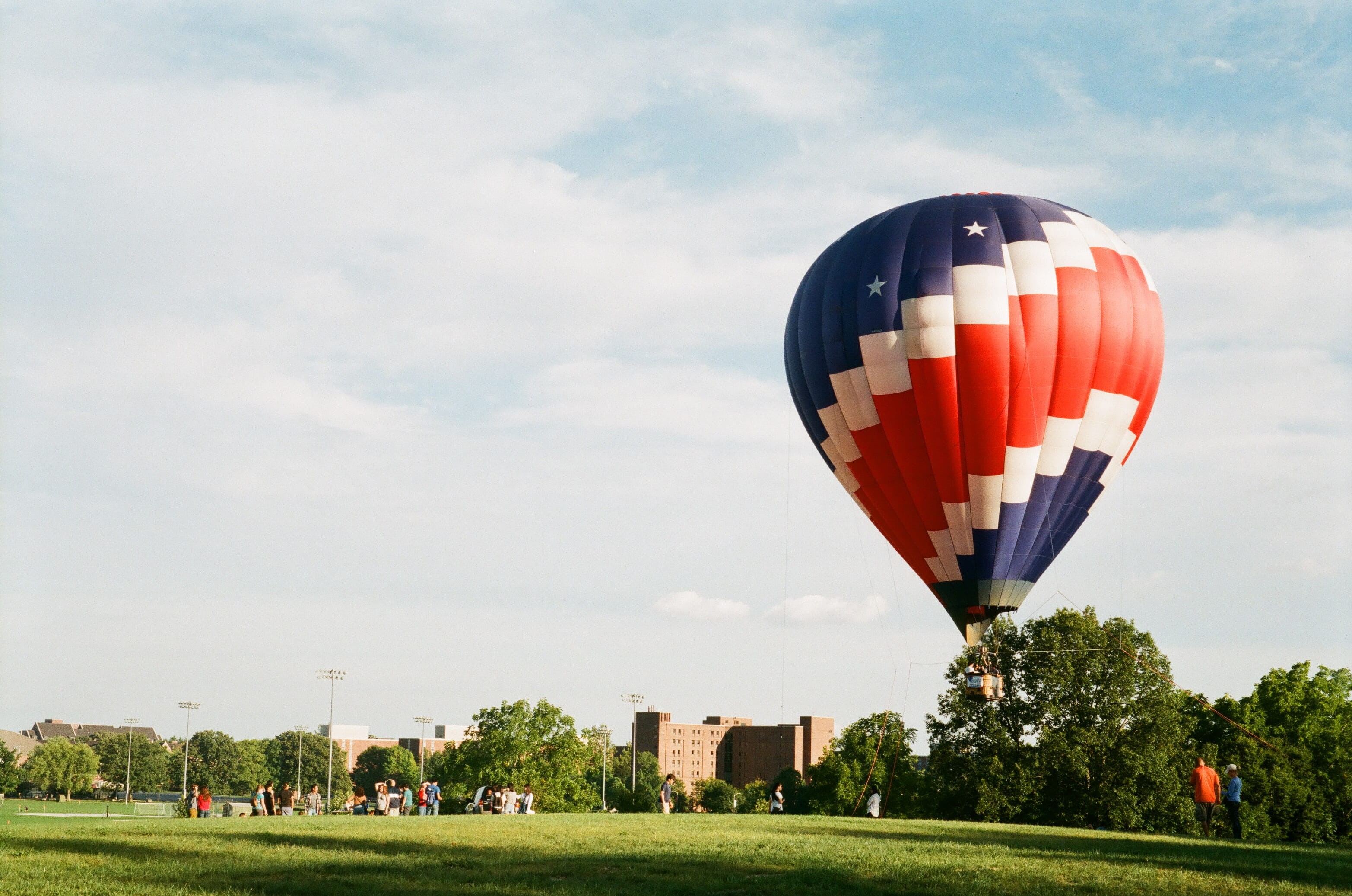 sky, outdoors, air vehicle, hot air balloon, purdue university, incidental people, summer, ballooning festival, cloud - sky, land, group of people, mid-air, HD Wallpaper