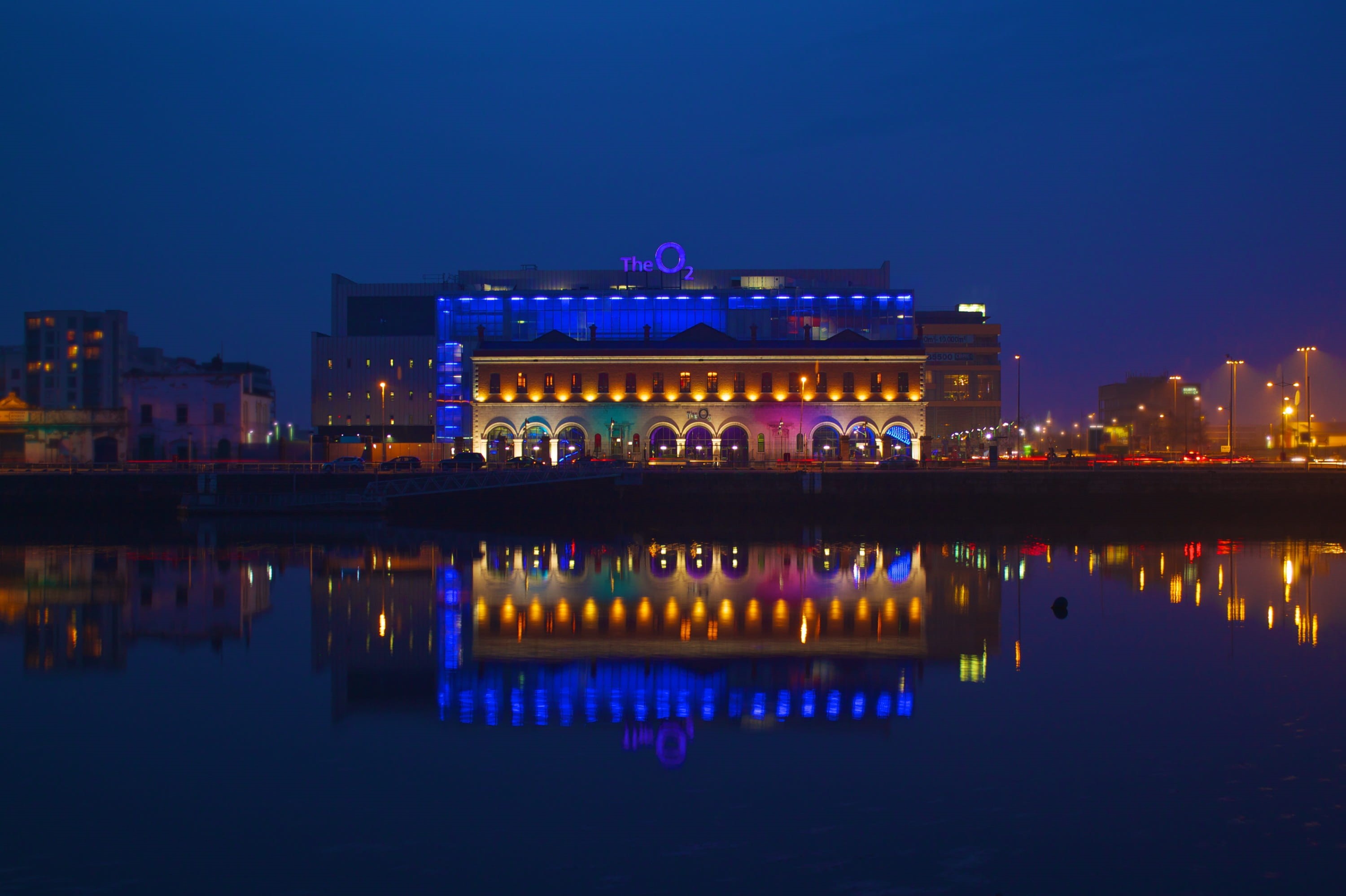 O2, lighted, 2K, near, cityscape, city, urban Scene, outdoors, reflexion, travel destinations, Building, Water, illuminated, lake, lights, standing water, HD Wallpaper