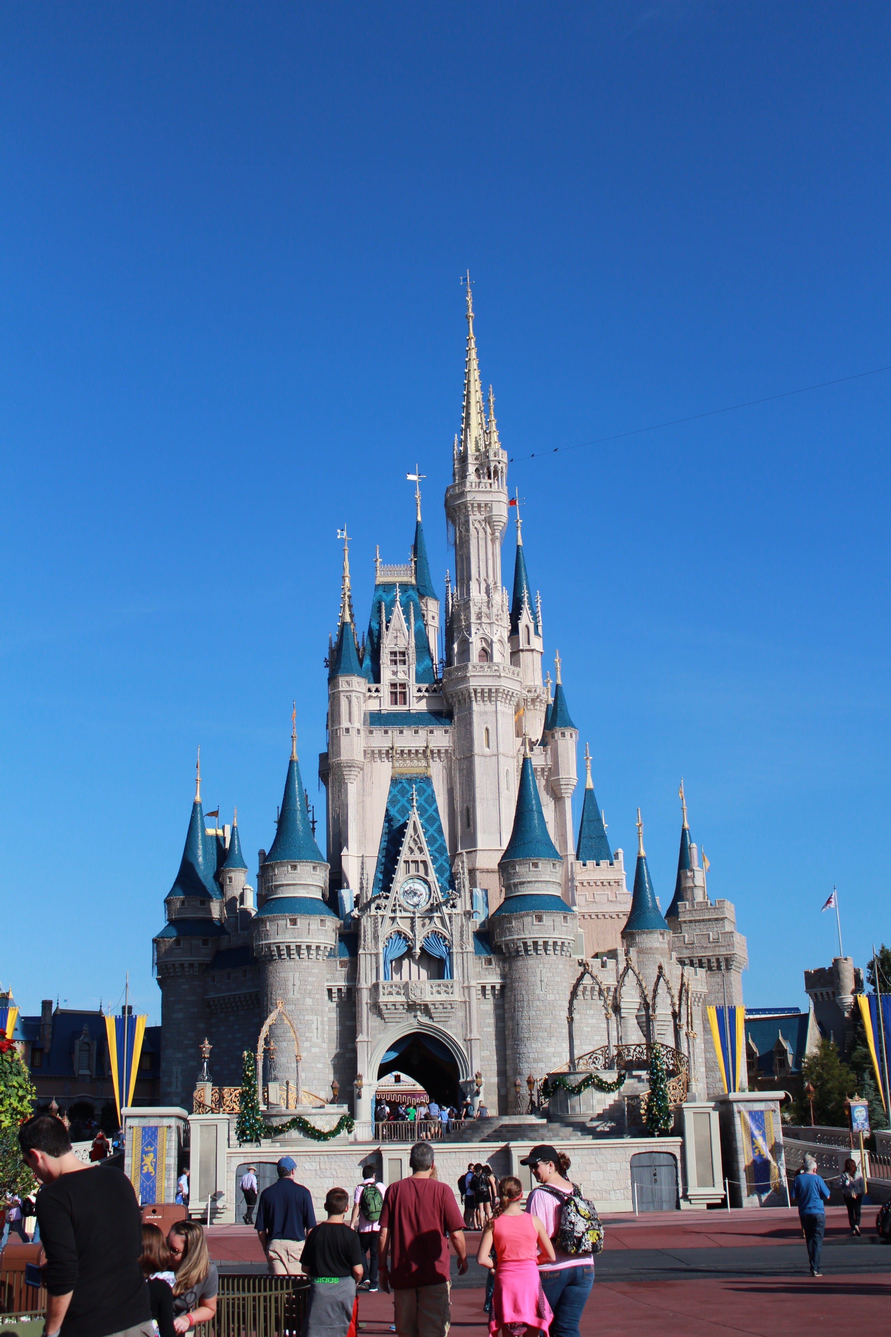history, tourism, real people, Magic Kingdom, spire, belief, large group of people, theme park, daytime, building exterior, spirituality, building, blue, Phone HD Wallpaper