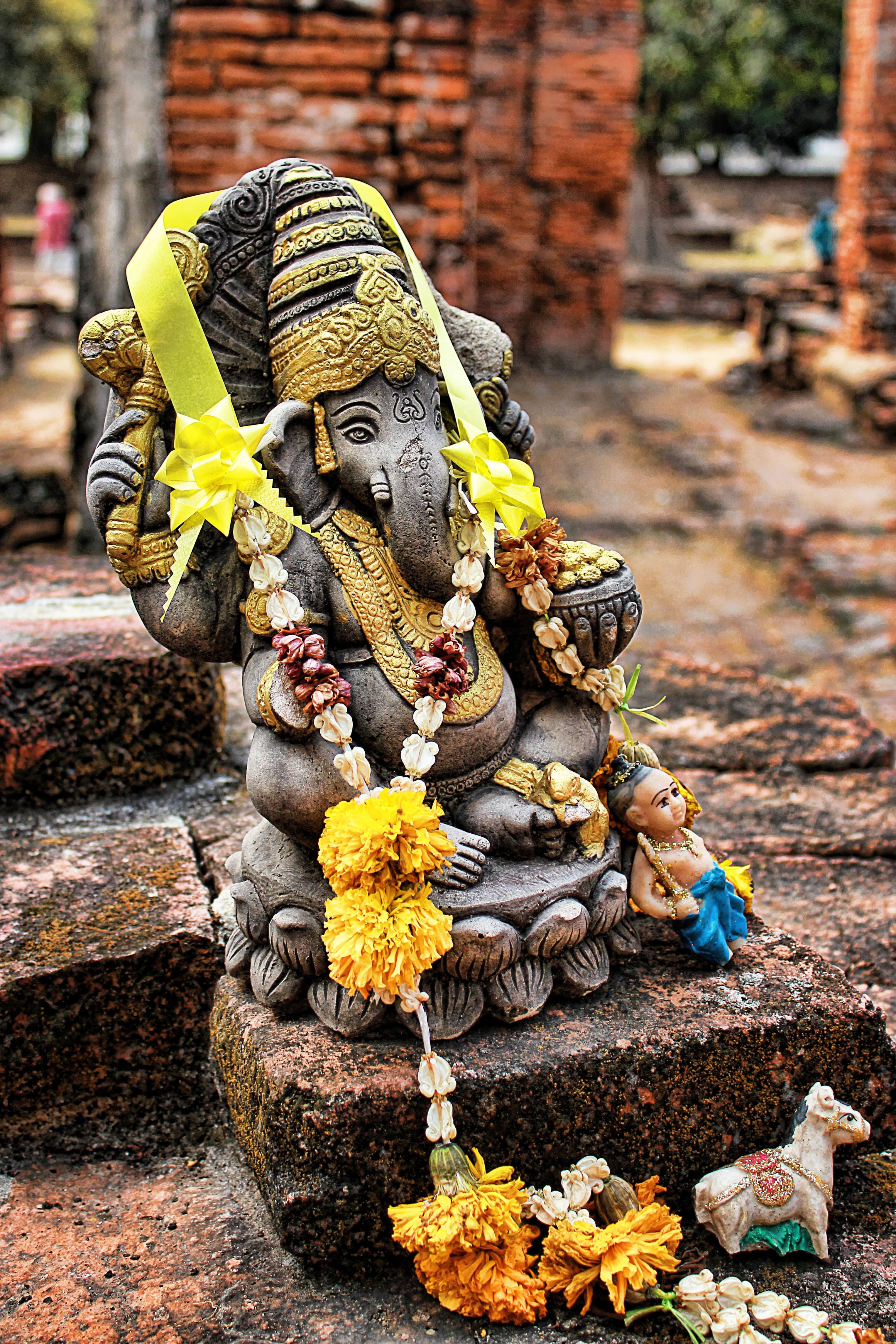 craft, 4K, architecture, figurine, flowering plant, human representation, brick, art and craft, statue, flower, altar, place of worship, day, focus on foreground, Phone HD Wallpaper