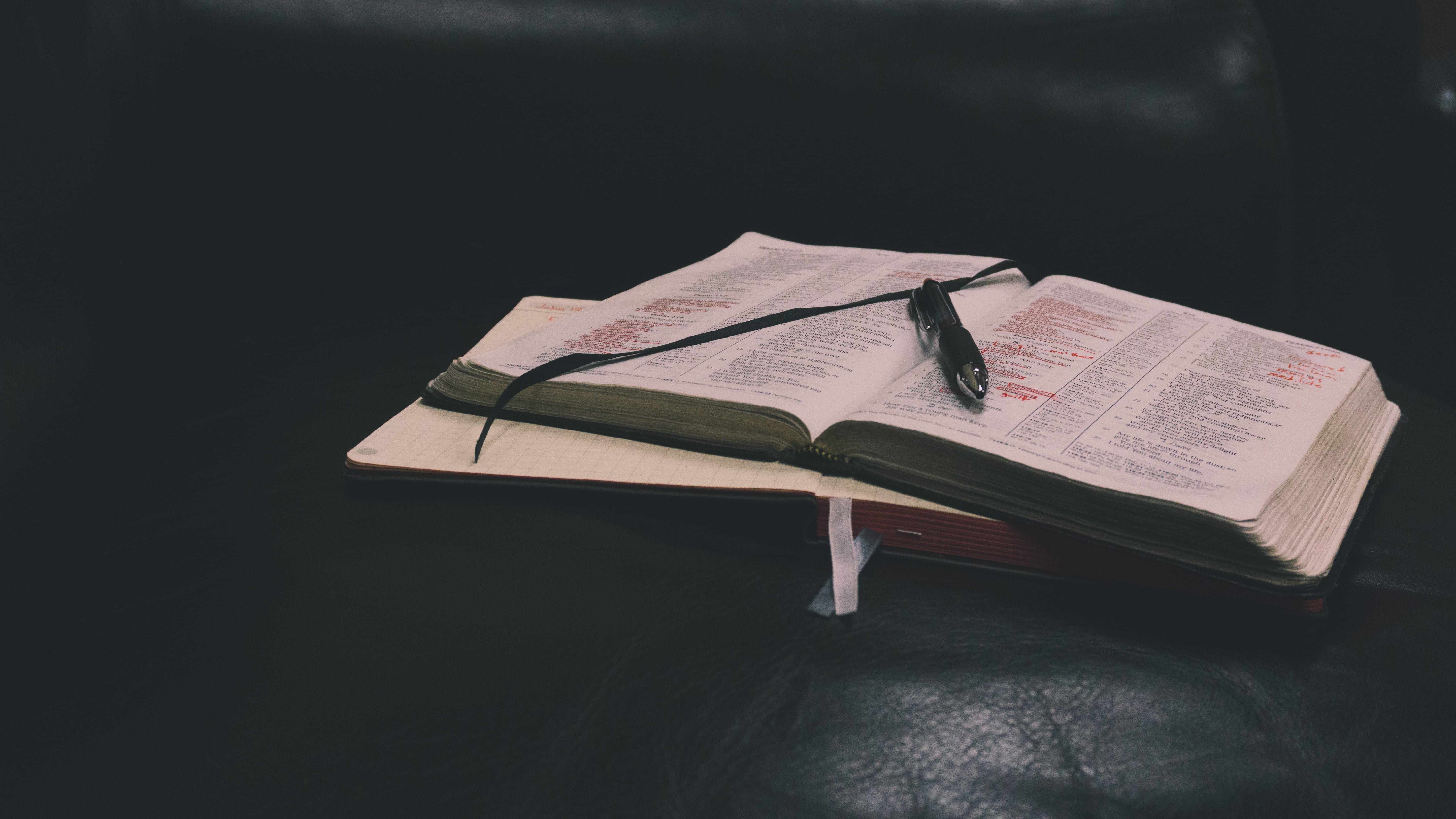 paper, literature, photo, ribbon, bible, indoors, reading, spirituality, sofa, studio shot, table, black, page, no people, two, publication, black background, HD Wallpaper