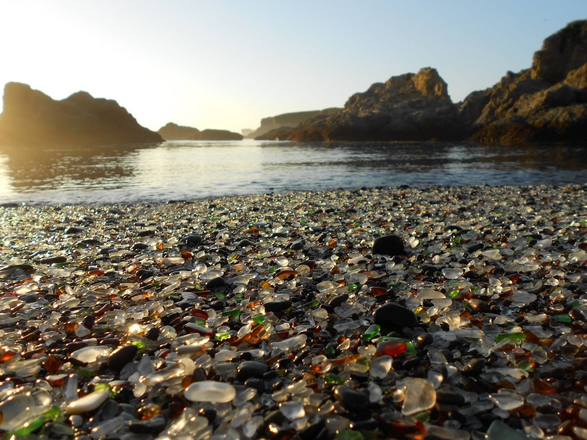 rock - object, sea, pebbles, tranquility, water, clear sky, nature, beach, sunlight, outdoors, lot, rock, no people, sky, tranquil scene, color, pebble, HD Wallpaper