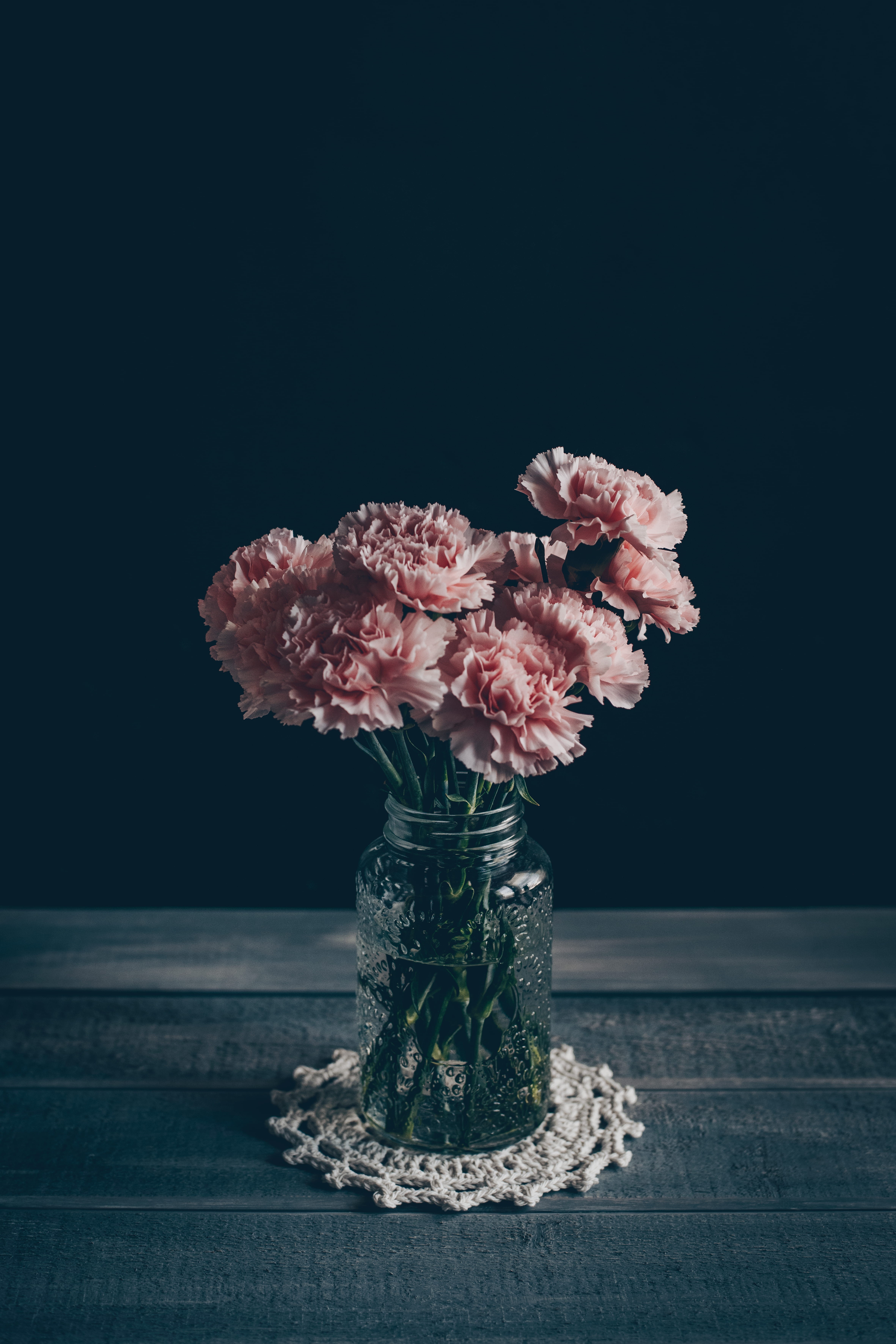 indoors, moody, table, crochet, bunch of flowers, close-up, black background, simple, flower arrangement, 5K, flowering plant, carnation, freshness, flower, Phone HD Wallpaper