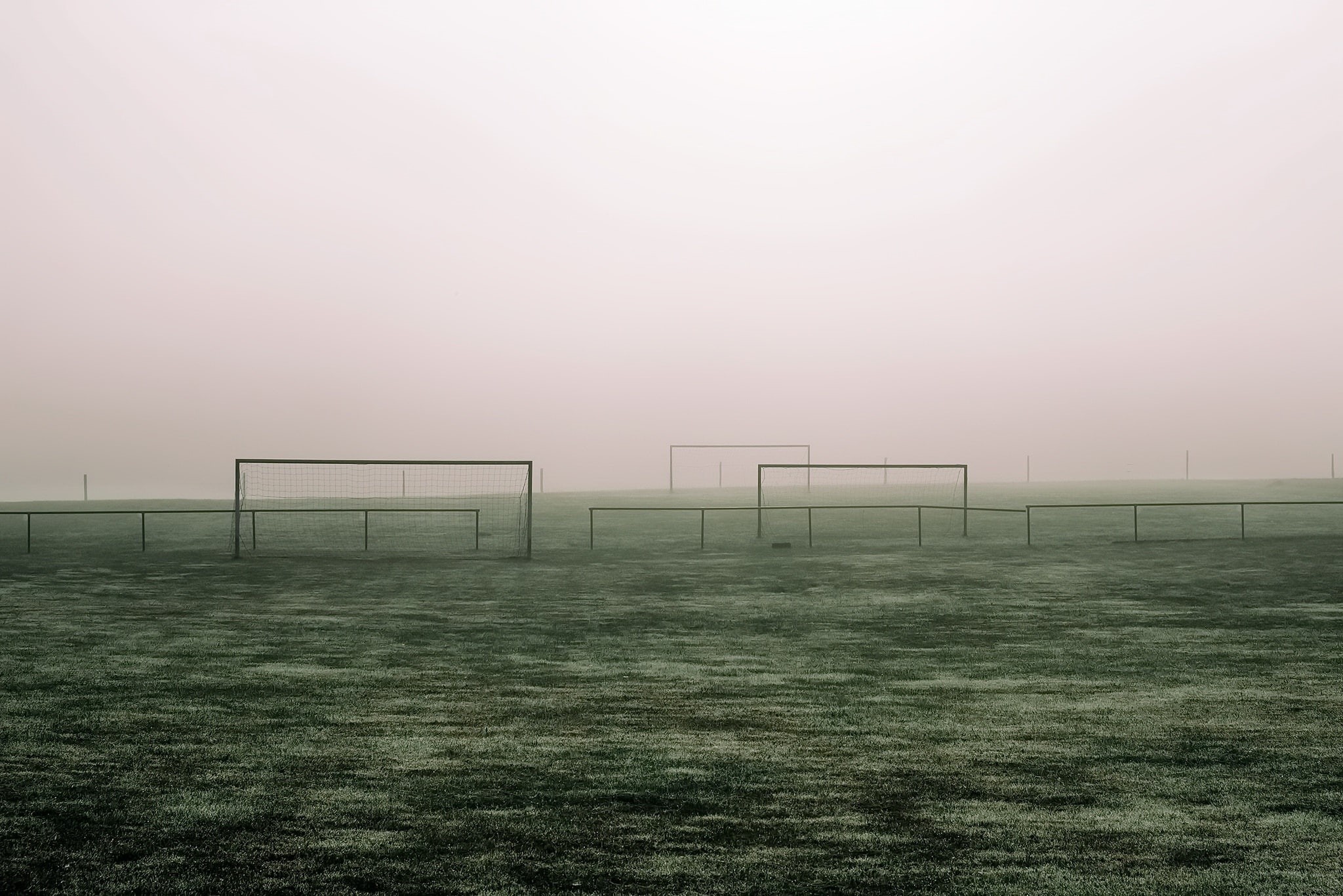 mist, beauty in nature, nature, tranquility, sport, absence, built structure, land, no people, sky, copy space, grass, tranquil scene, minimalism, soccer pitches, HD Wallpaper