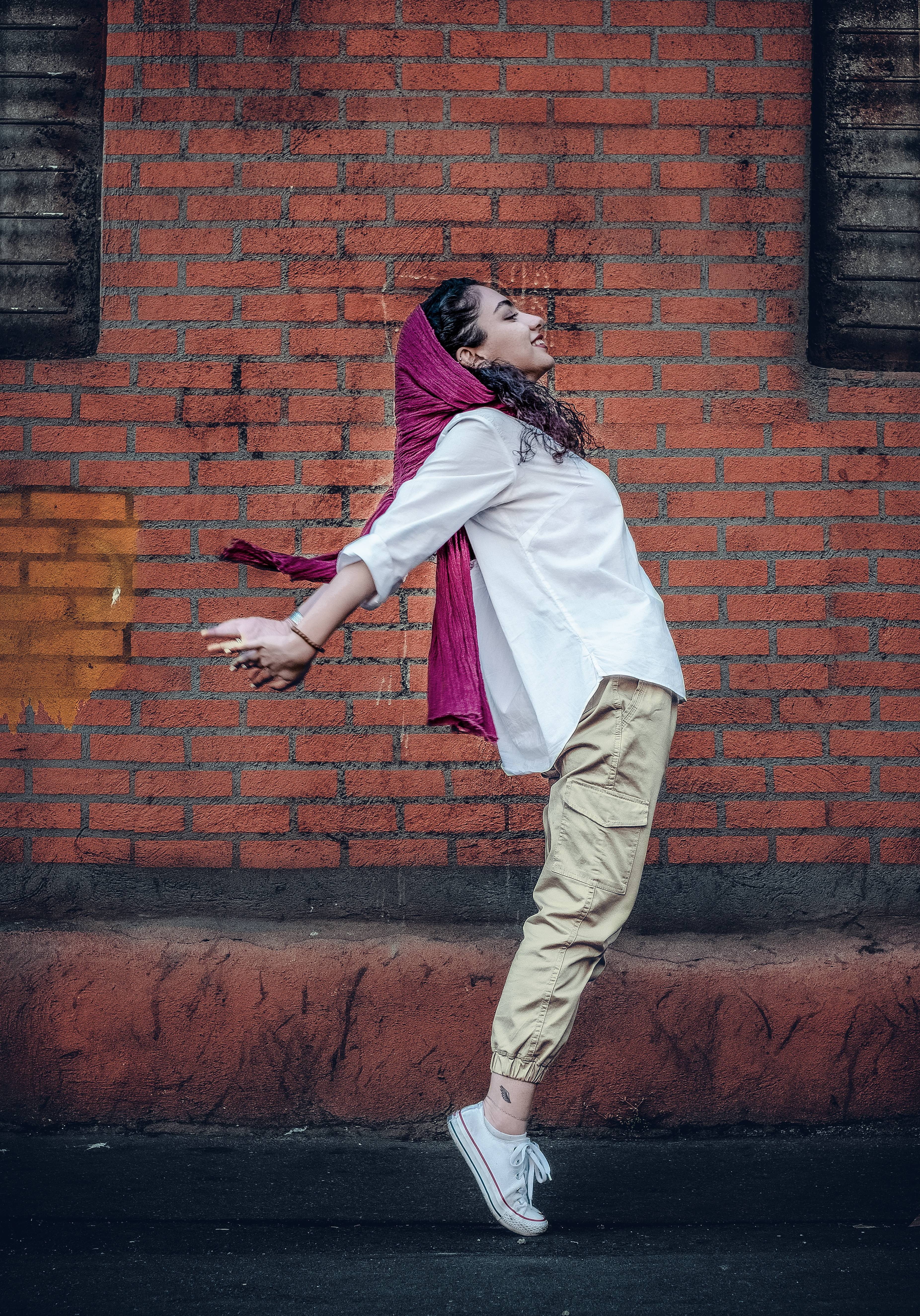 woman, human, standing, casual clothing, outdoors, clothing, apparel, sport, day, 5K, wall, one person, streetstyle, brick, brick wall, wall - building feature, Phone HD Wallpaper