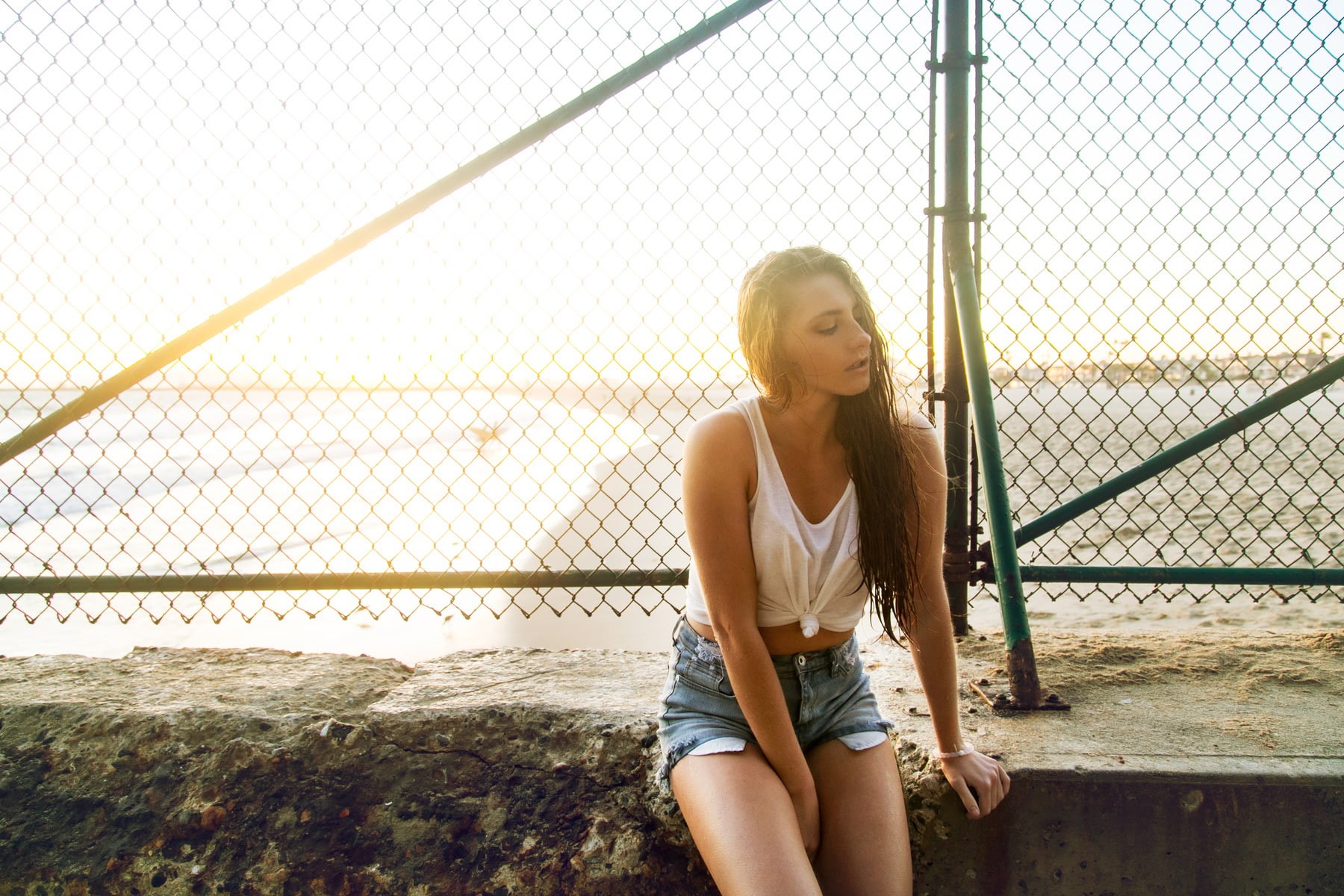 hair, long hair, sky, young adult, contemplation, day, fence, barrier, sitting, real people, tank top, sunset, beautiful woman, blonde, women, boundary, HD Wallpaper