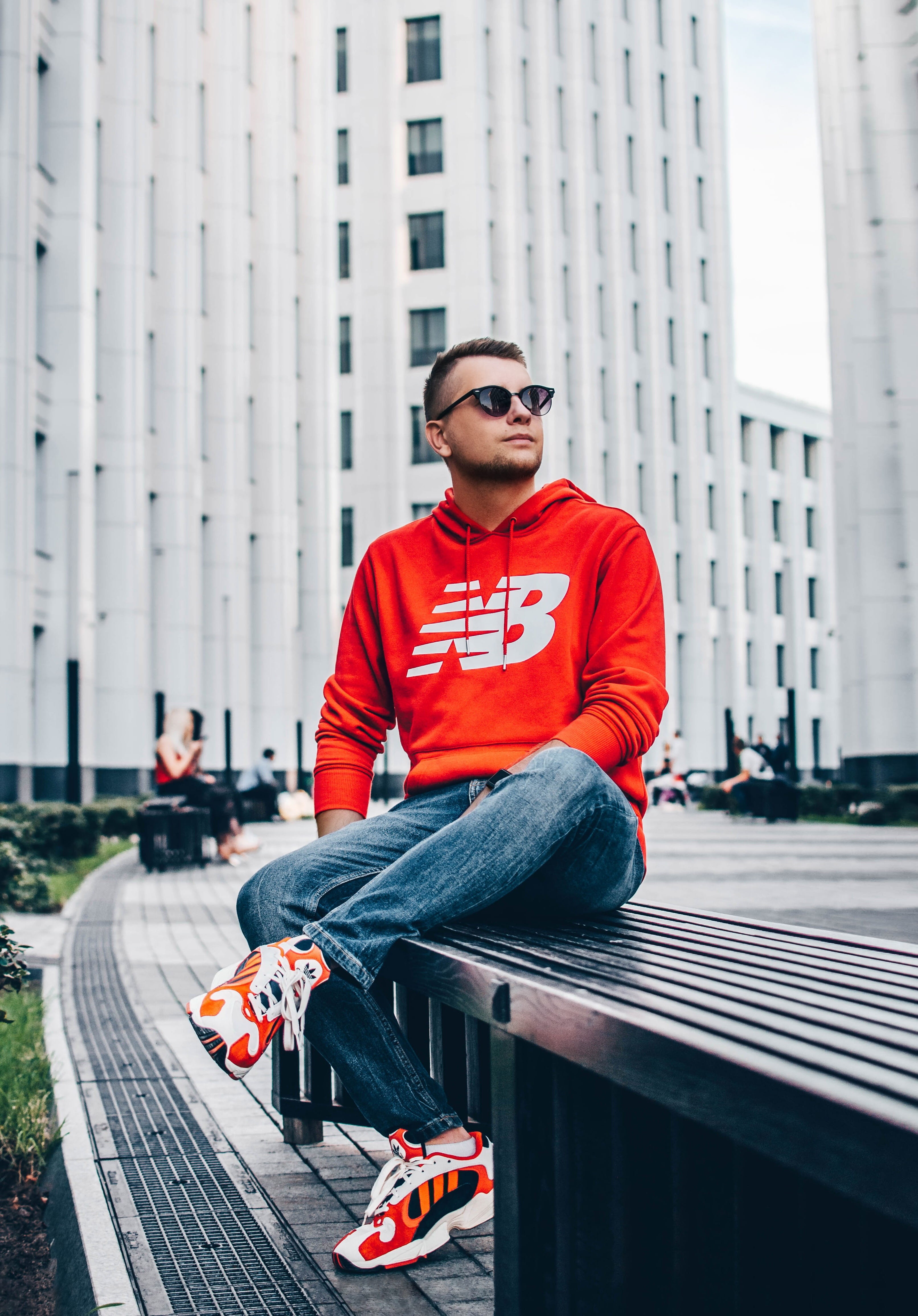human, casual clothing, clothing, city, shoe, architecture, day, sunglasses, front view, white, building exterior, incidental people, man, bench, people, Phone HD Wallpaper
