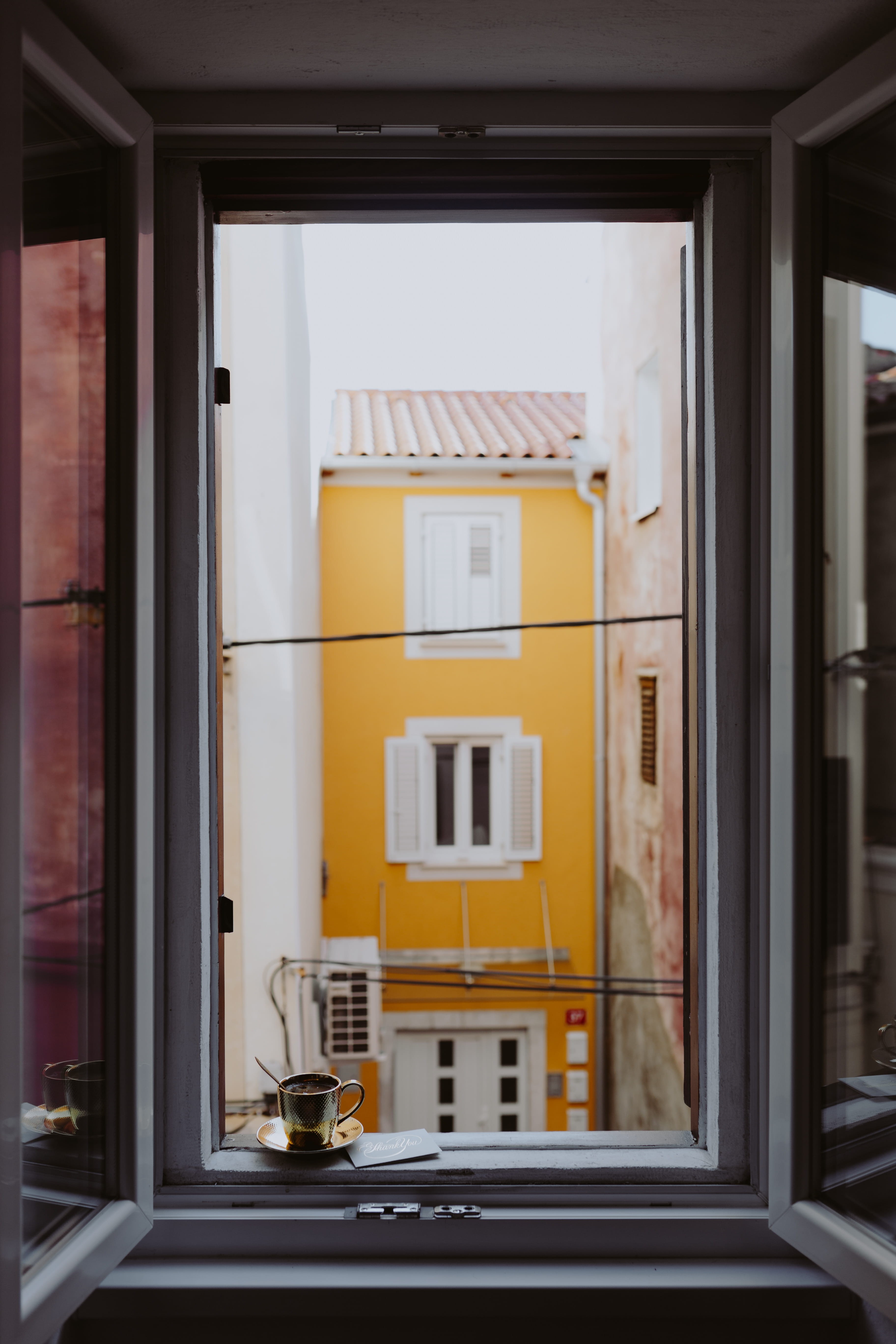 city, coffee, apartment, isola, cup, morning, nature, window frame, building, built structure, outdoors, golden, black coffee, transparent, glass - material, Phone HD Wallpaper