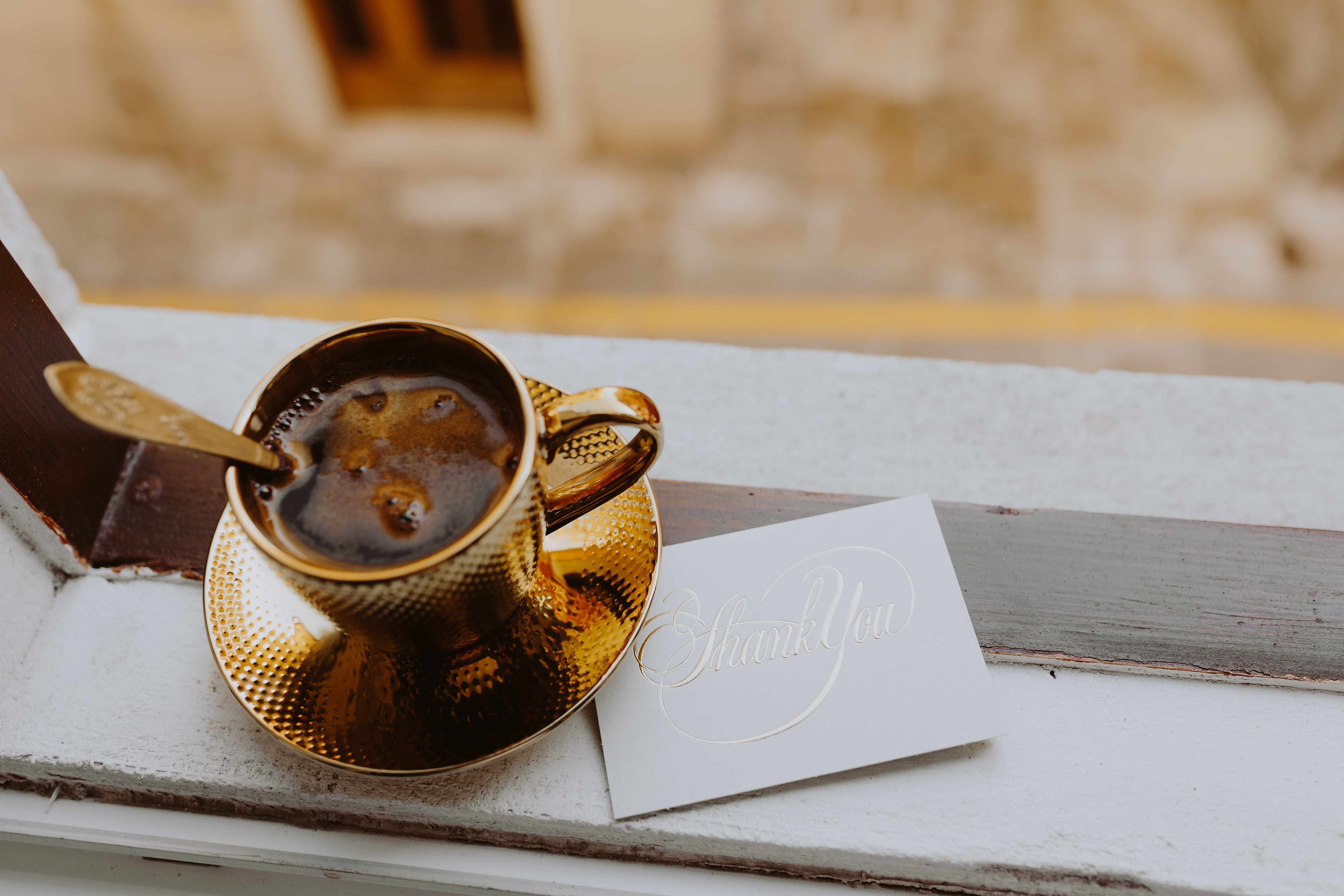 container, kitchen utensil, close-up, gift, food, golden, cafe, gold, western script, focus on foreground, day, black coffee, coin, 5K, still life, drink, HD Wallpaper