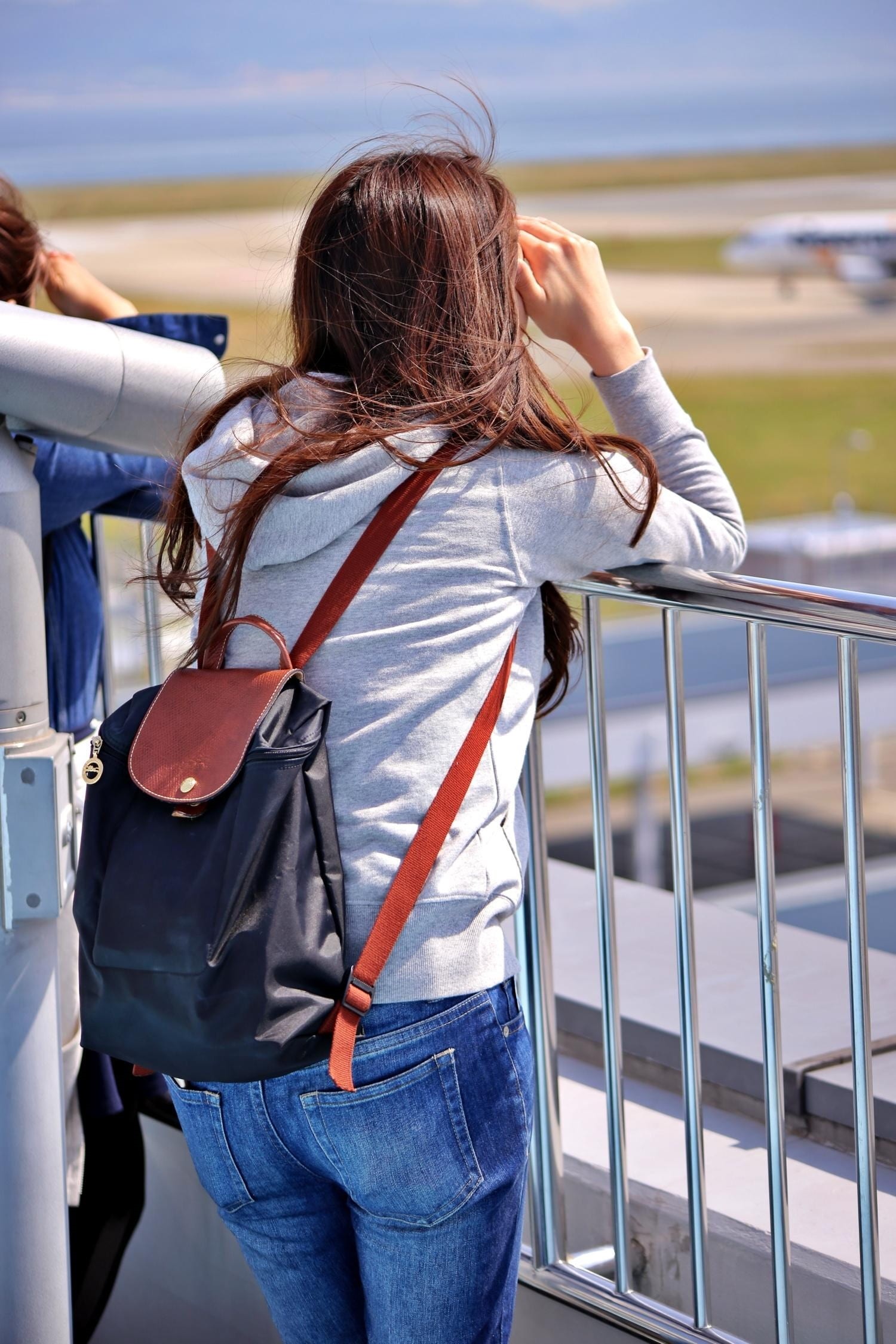 outdoors, kansai international airport, three quarter length, one person, denim, transportation, casual clothing, hairstyle, railing, adult, real people, Phone HD Wallpaper