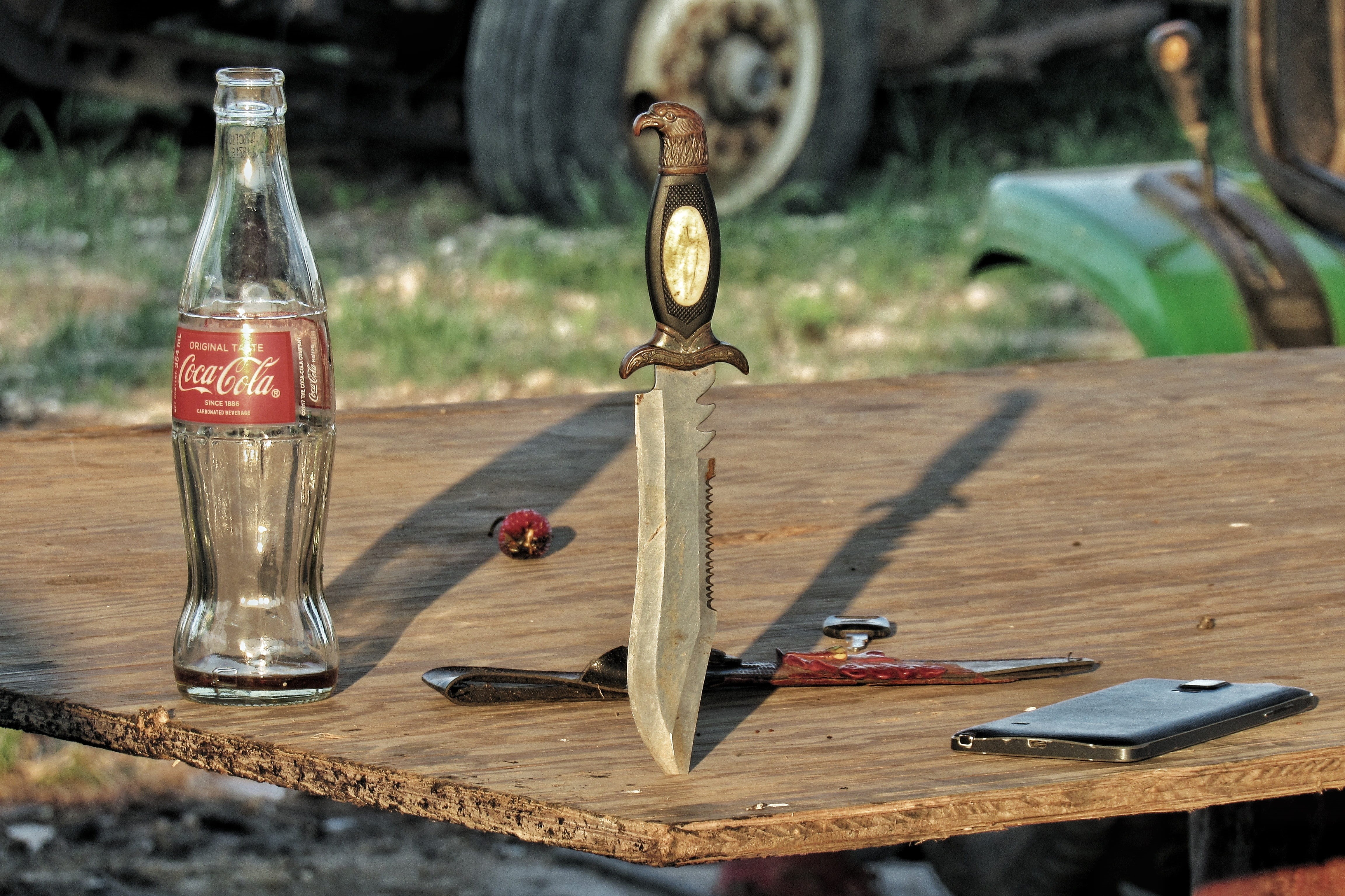 dof, glass - material, outdoors, still life, container, metal, sunlight, phone, tire, habanero, old, game, equipment, coca-cola, glass, knife, close-up, HD Wallpaper