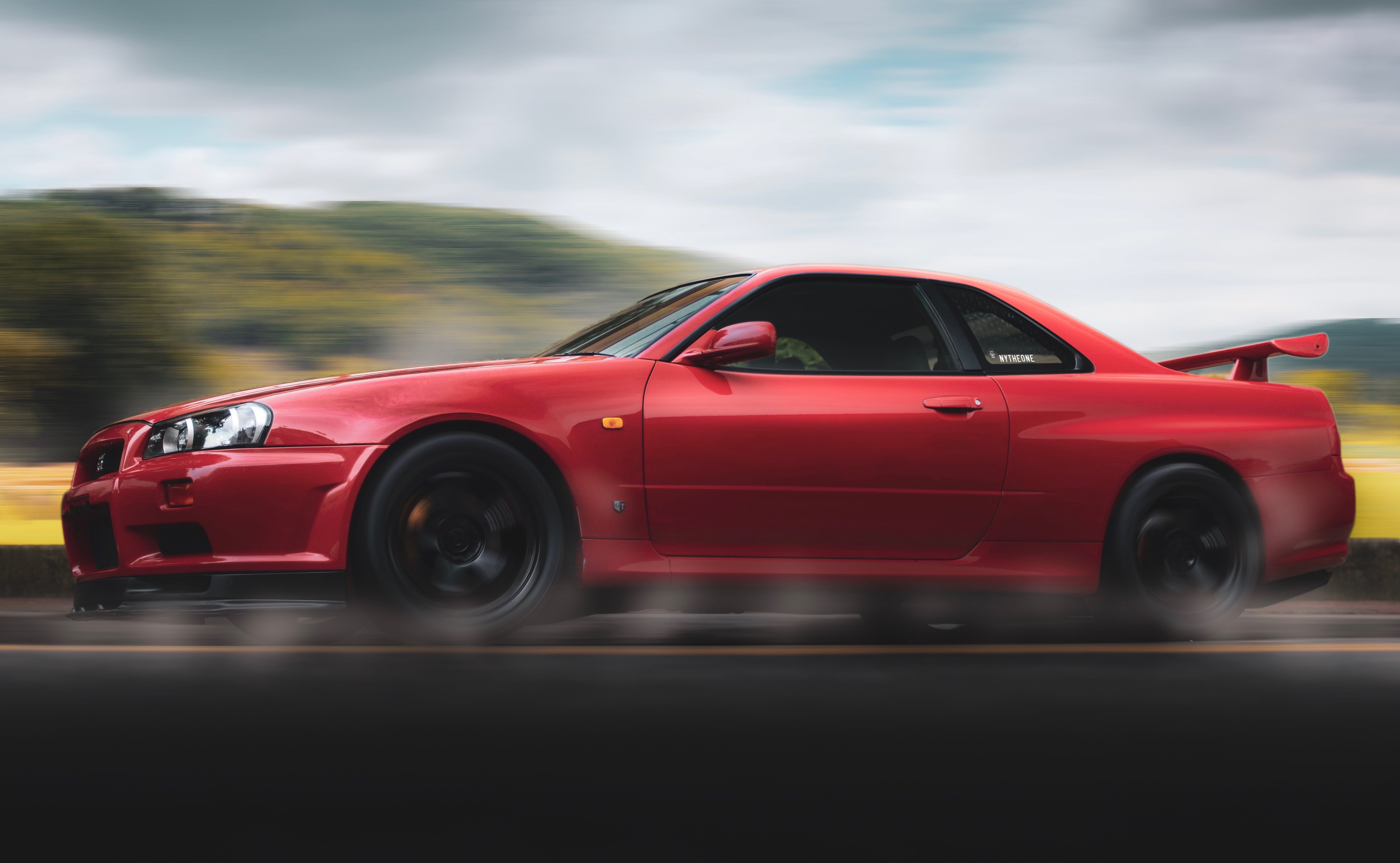 blurred motion, on the move, automobile, photography, shiny, road trip, cloud - sky, sports car, design, speed, 5K, nissan, city, motor vehicle, auto, HD Wallpaper